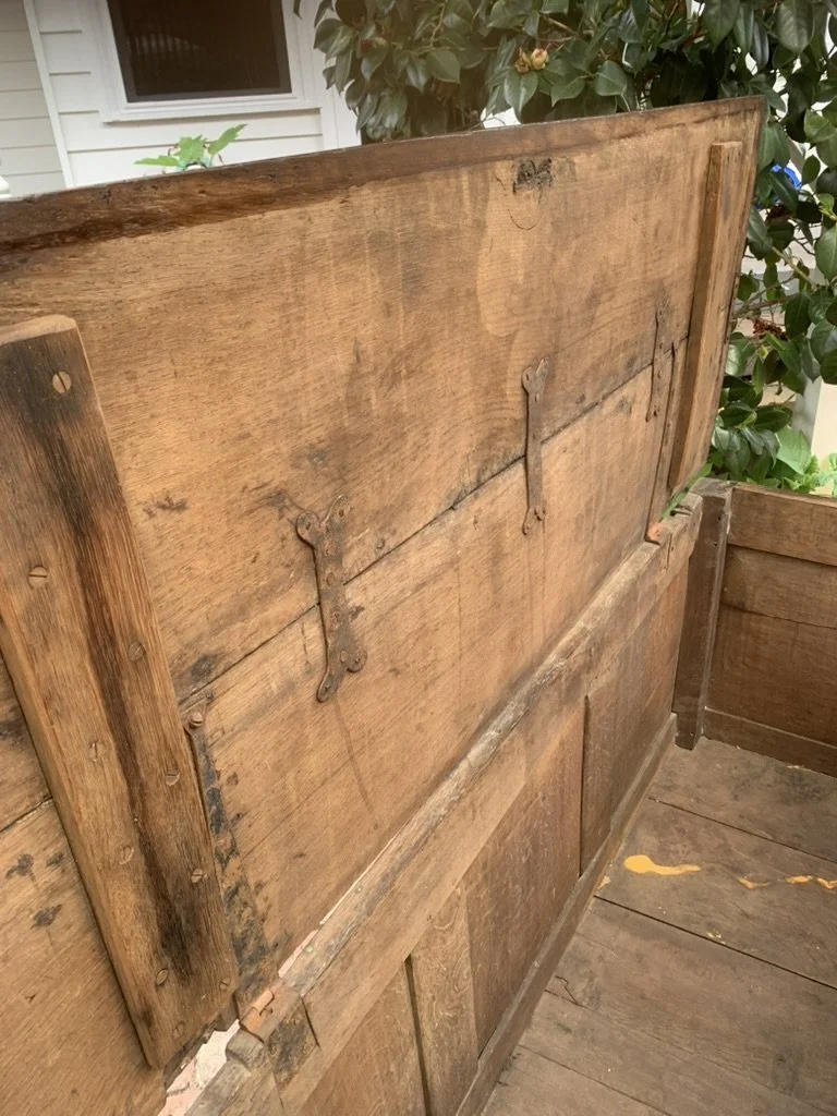 Underside of two plank lid on C.1680-1720 antique oak coffer, iron hinges, cleats and old repairs, English oak chest