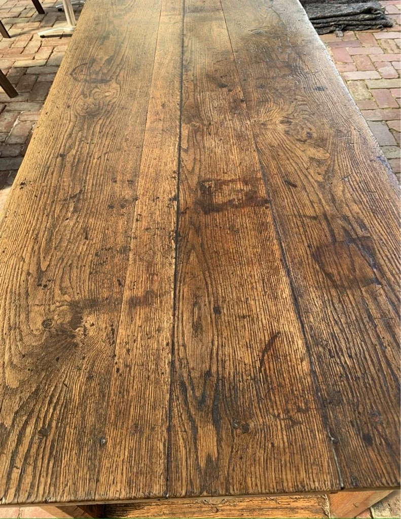 Antique French oak table top detail — three-plank construction with rich patina and aged surface character