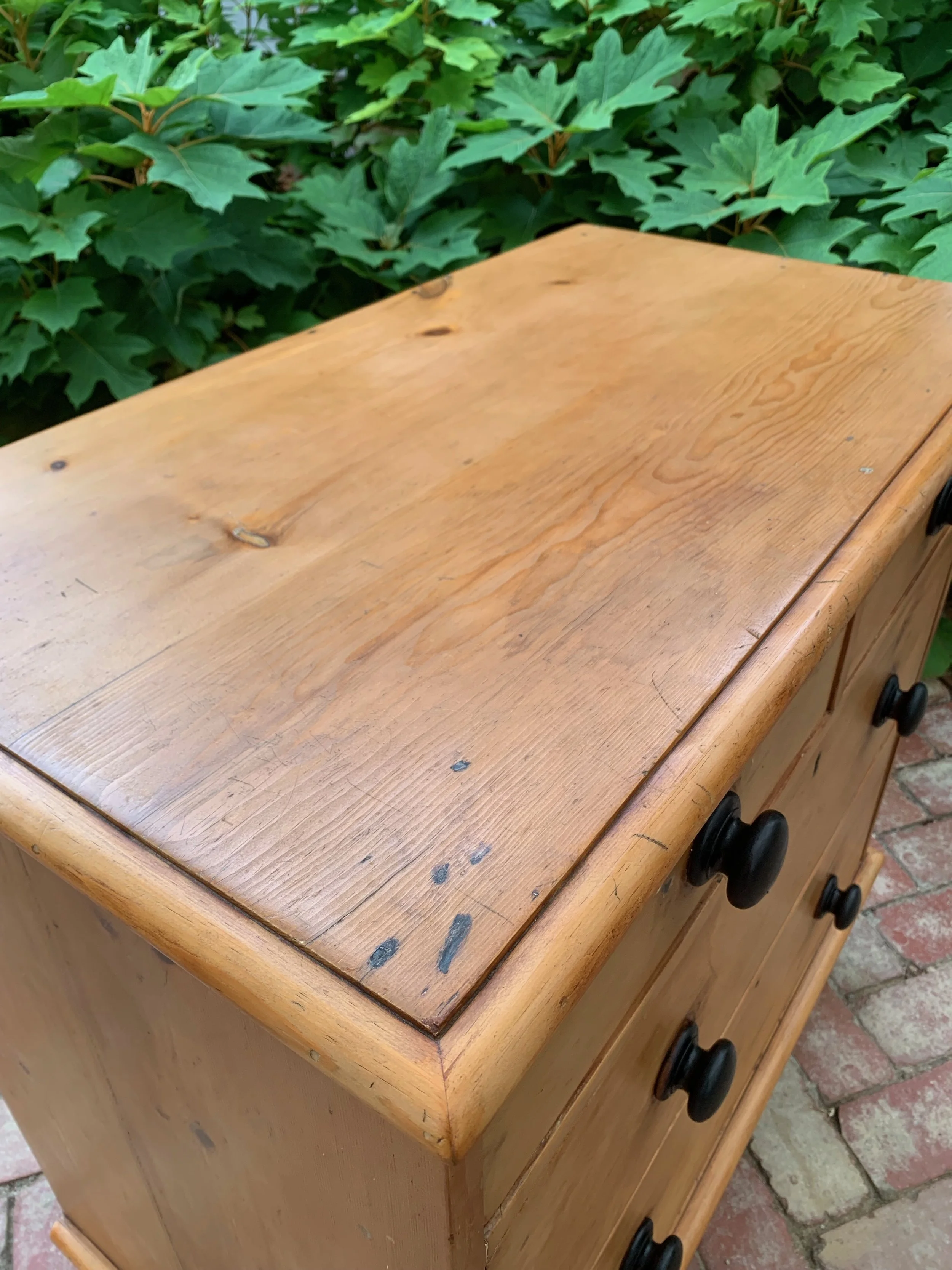 View of top surface of antique country pine chest of drawers