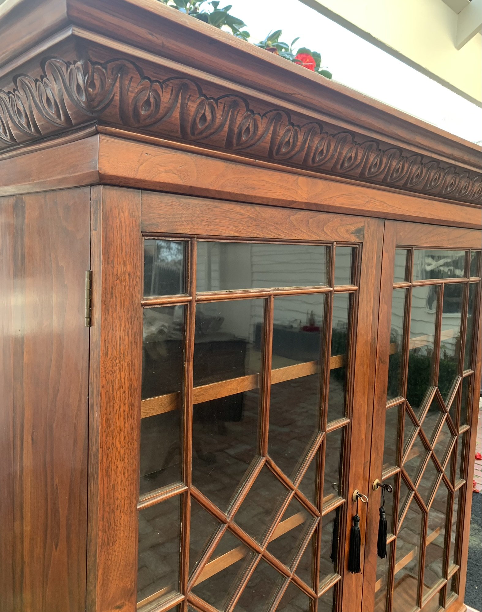 Antique English walnut bookcase C.1910 carved dentil cornice detail diamond lattice glazed doors