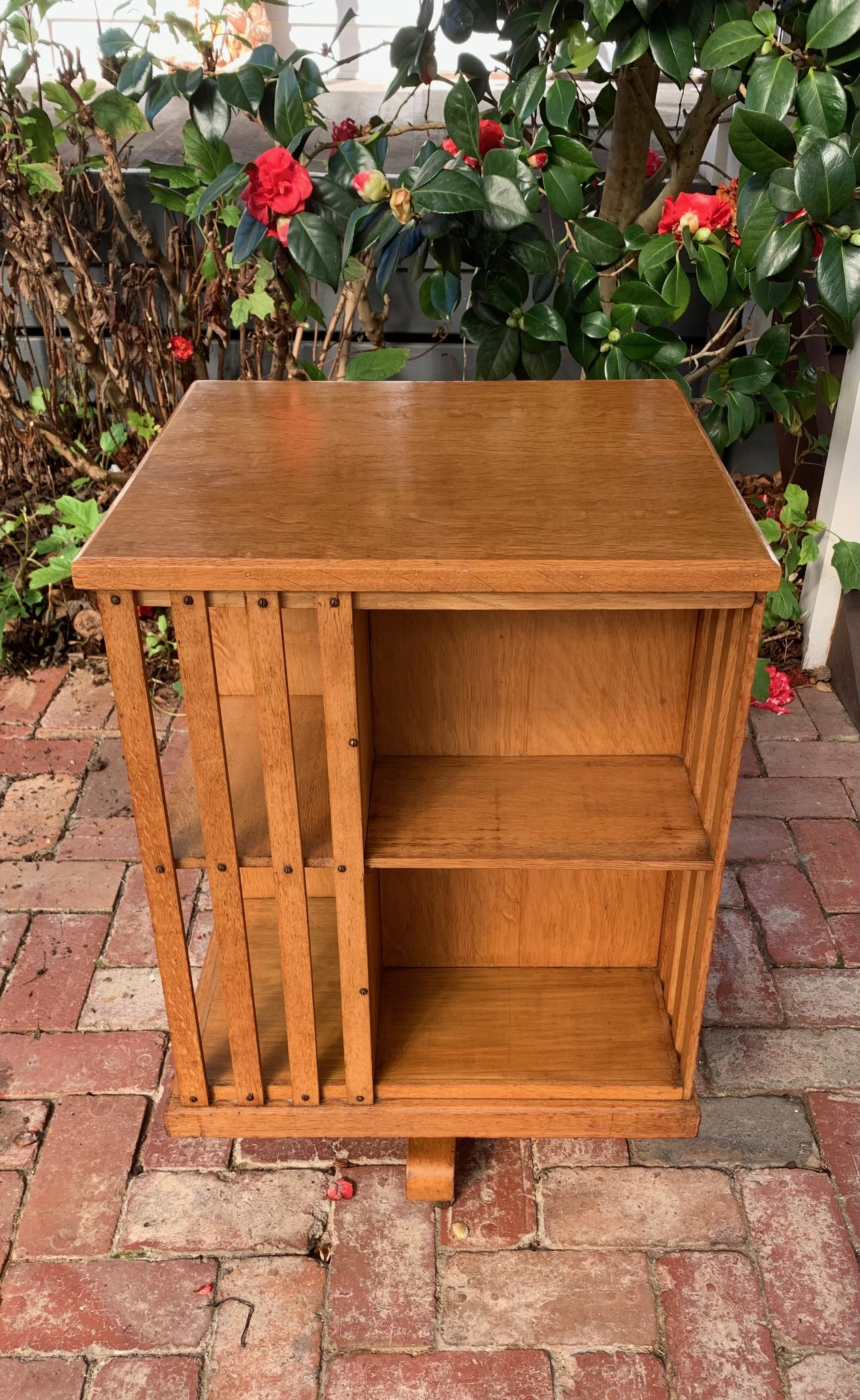 Edwardian oak revolving library bookcase front view, four-compartment rotating bookshelf design