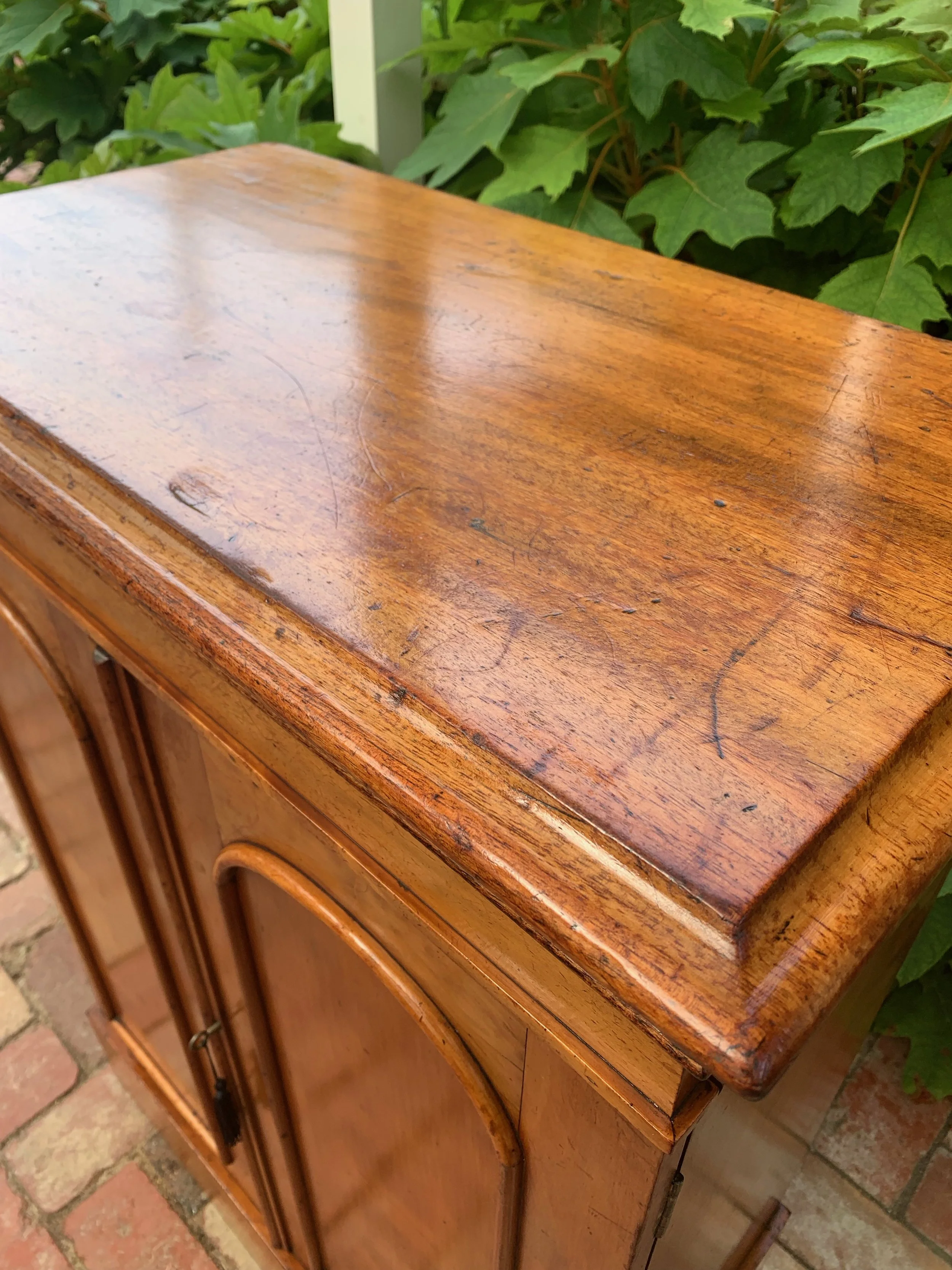 close up of cedar top of antique collector's cabinet