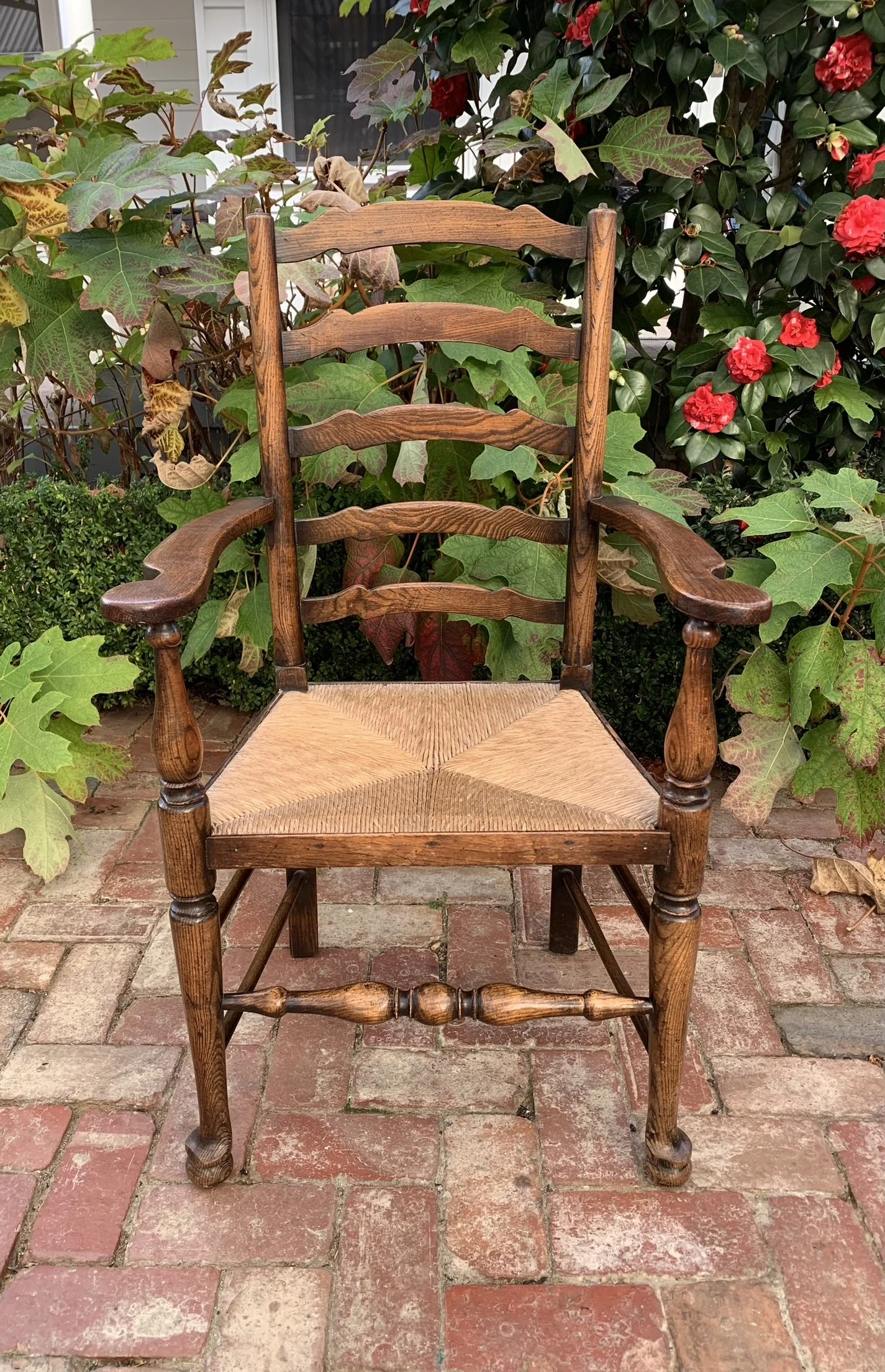 Antique oak and ash carver armchair, wavy ladderback with rush seat, Lancashire England c.1850