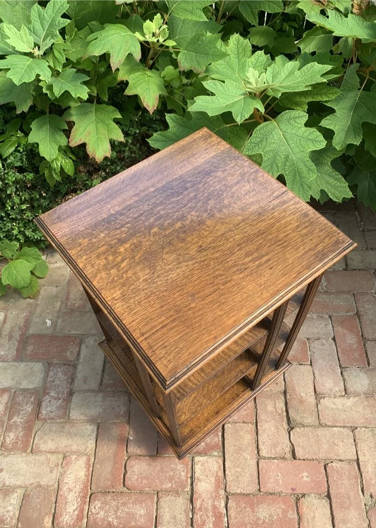 Bird's-eye view of Edwardian quartersawn oak revolving bookcase top, stepped moulded edge, c.1910