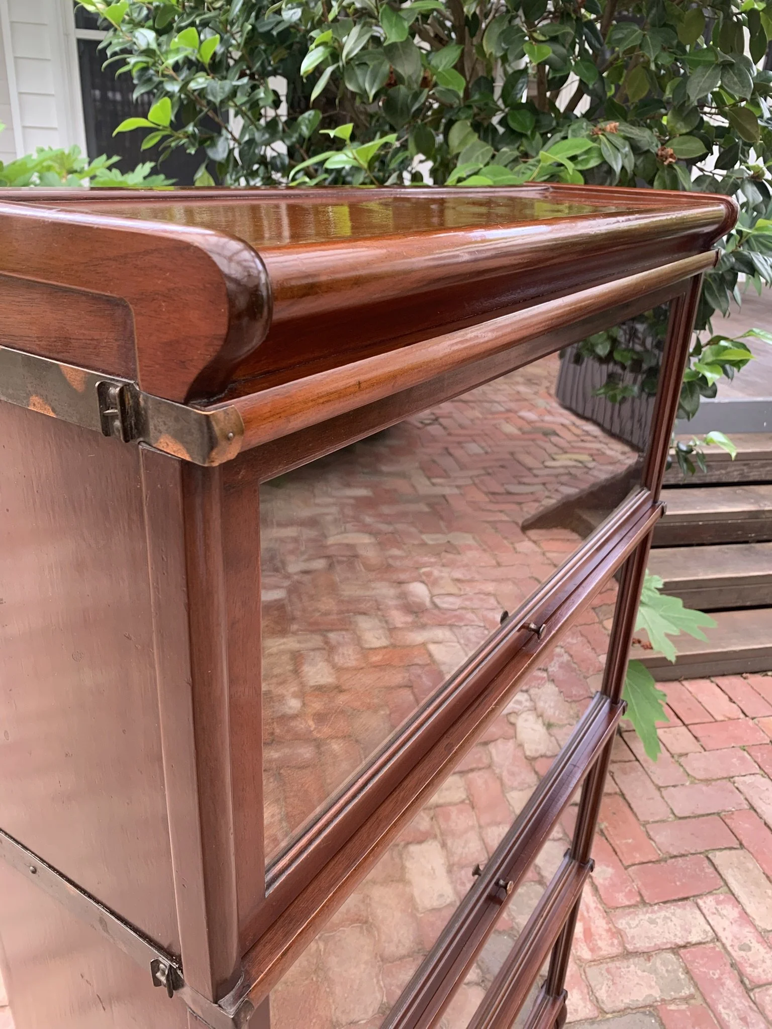 Brass interlocking side straps on Globe Wernicke modular cabinet