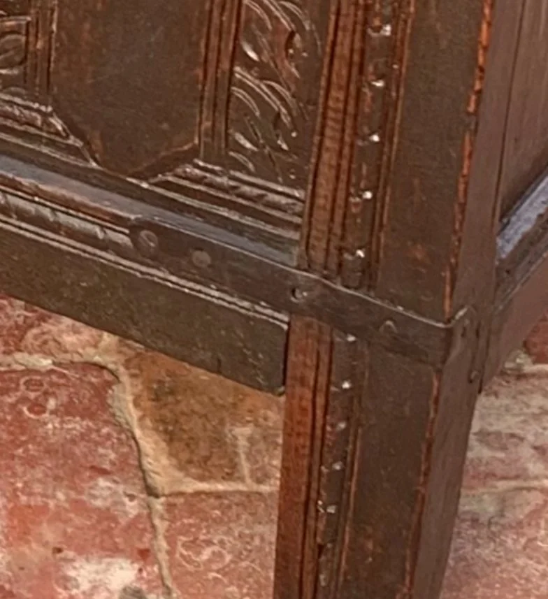 Oak coffer c.1660 lower front corner pegged joinery steel strapping old repair moulded rail stile leg detail