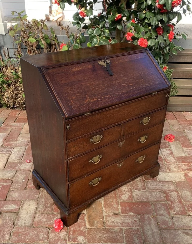 Side view of Georgian oak bureau chest