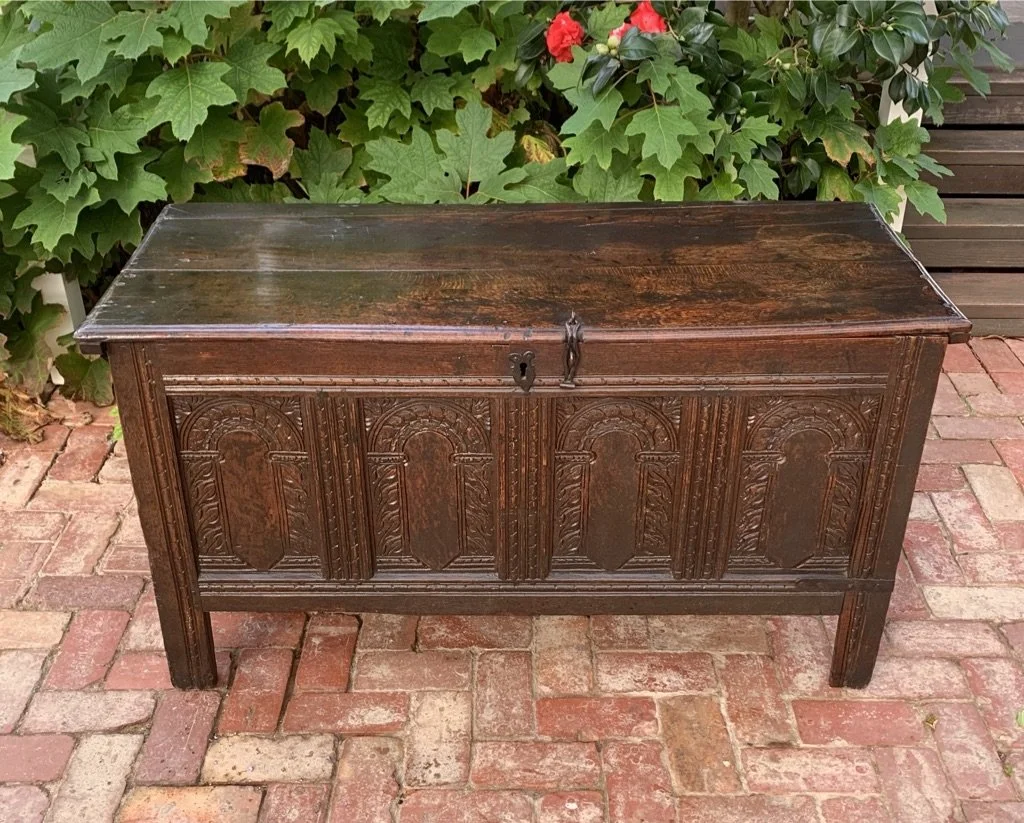 Carved English oak coffer c.1660 four arcaded panels roped stiles nulled frieze rail iron lock plate