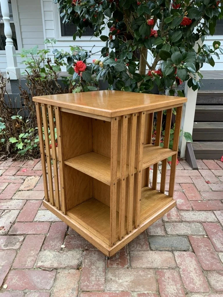 Empty antique oak revolving bookcase showing four-tier slatted shelving, English C.1910 library piece