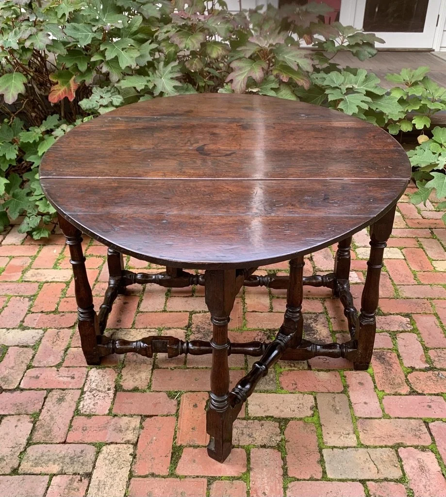 Oval oak drop-leaf table, English, c.1700, box stretcher base
