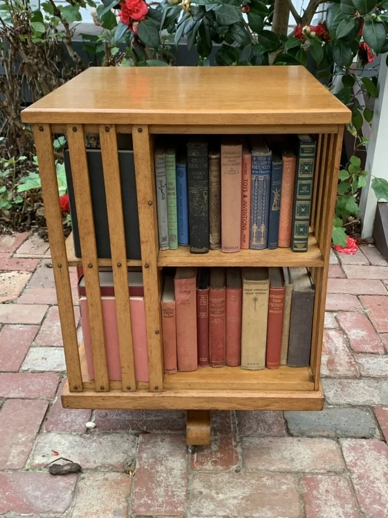Edwardian oak revolving bookcase front view with vintage book collection, English library bookshelf