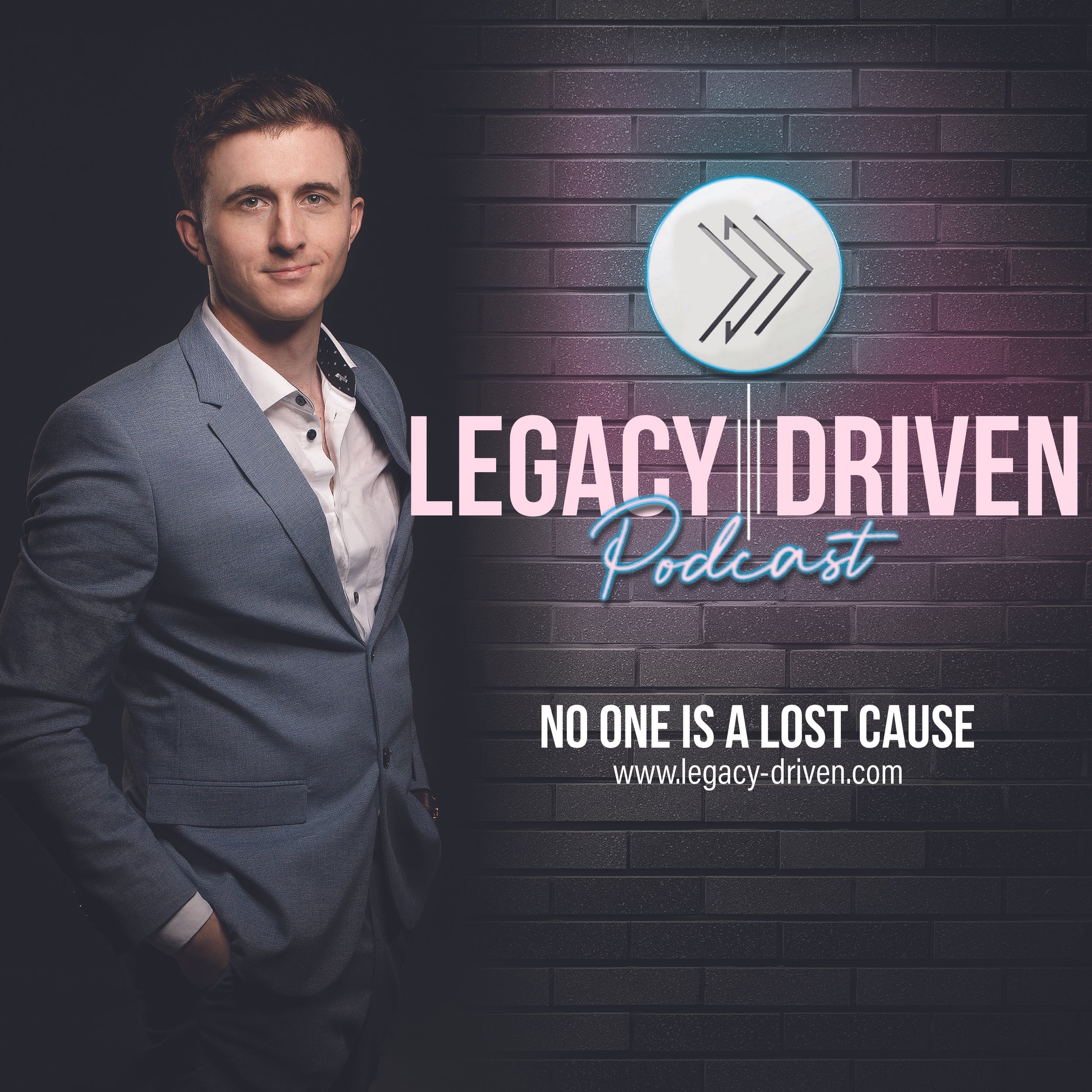 A man in a gray suit stands with his hands in his pockets against a dark brick wall. To his right, illuminated text reads, 'Legacy Driven Podcast' with a subtitle 'No one is a lost cause' and a website URL.