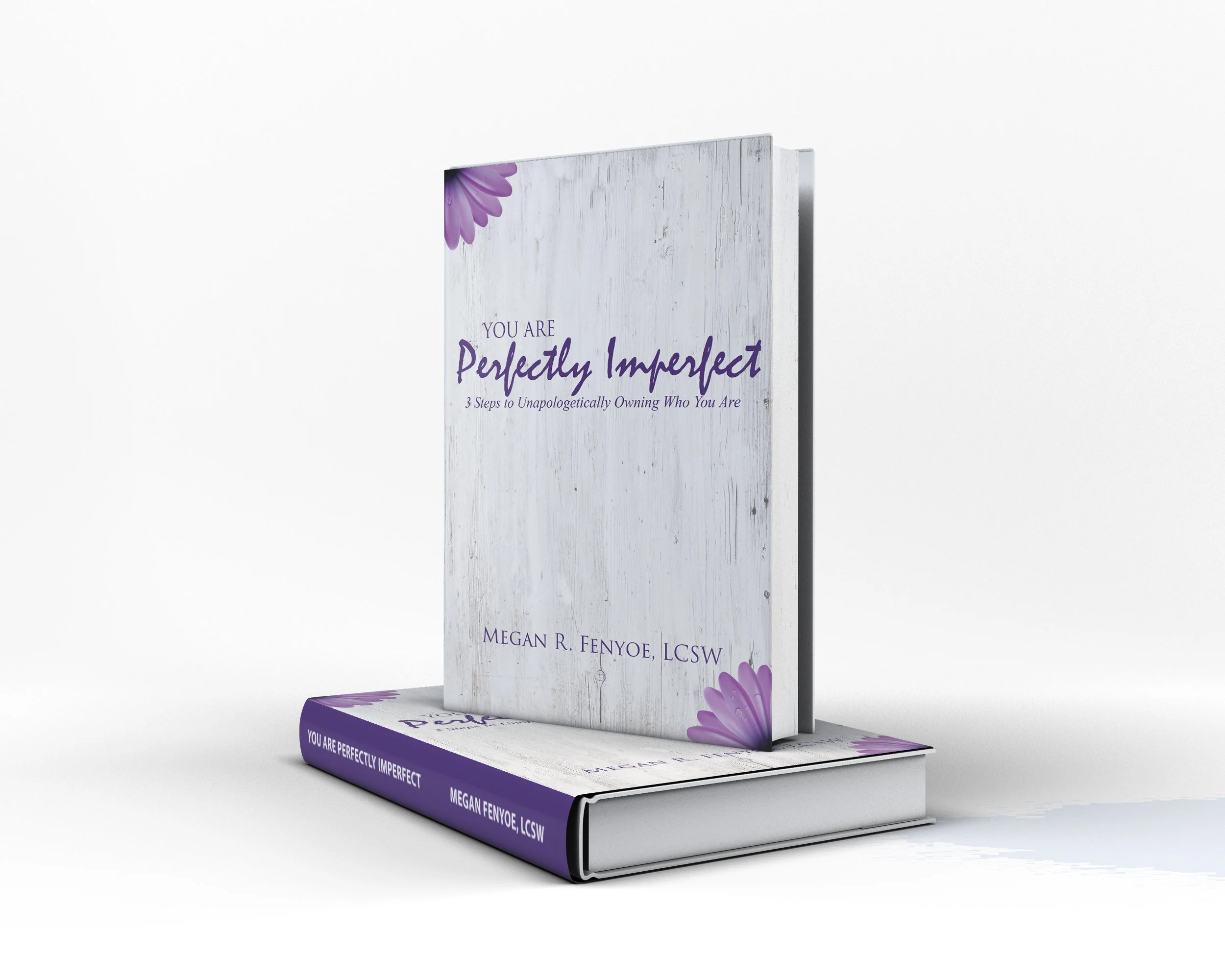 A 3D rendering of a book titled 'You Are Perfectly Imperfect' by Megan R. Fenyoe, LCSW, displayed standing upright with another copy lying flat underneath. The cover features a white wood background with purple flowers in the corners.