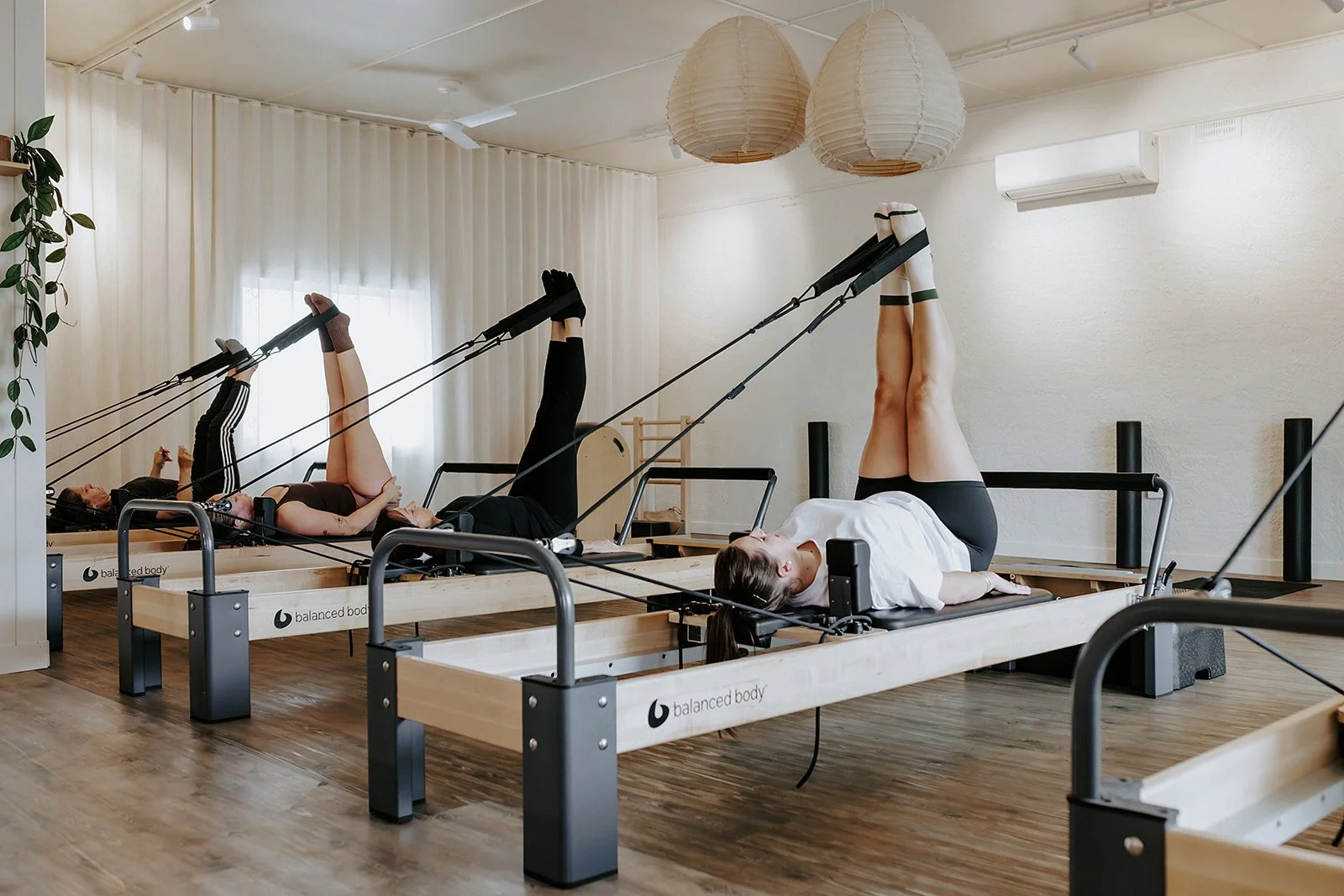 Group reformer Pilates class photographed for a Launceston Pilates studio