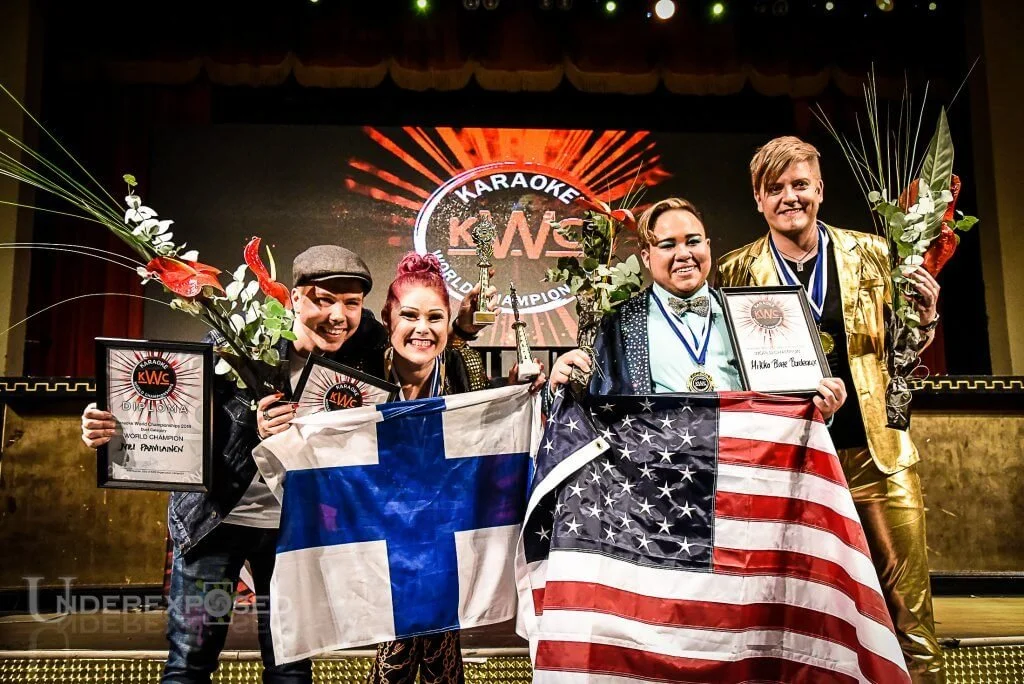 Official Event Photographer of the 2018 World Karaoke Championships in Helsinki, Finland | Winners holding flowers and flags with KWC logo