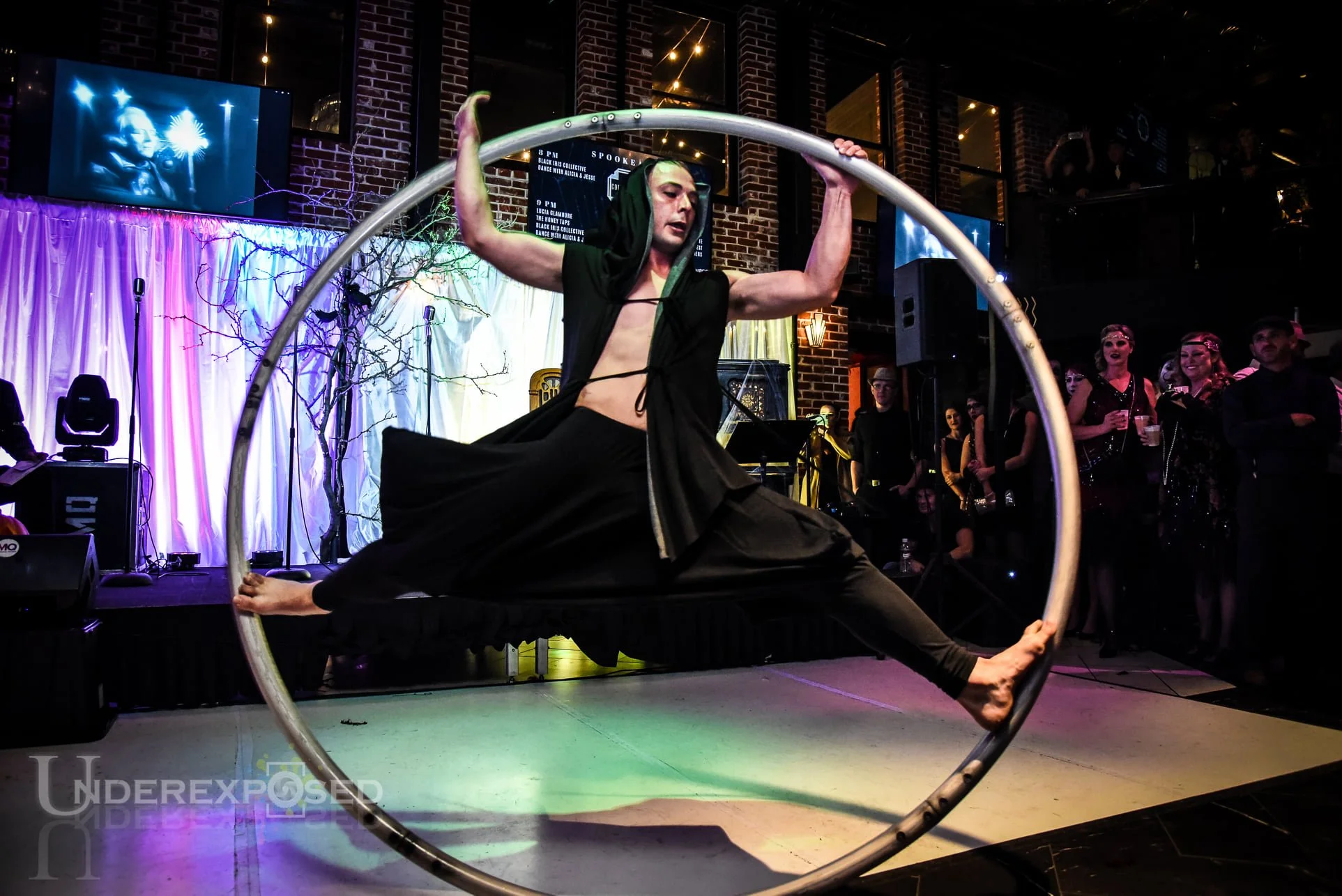 Low light event photography at a Denver event in downtown venue with circus performers