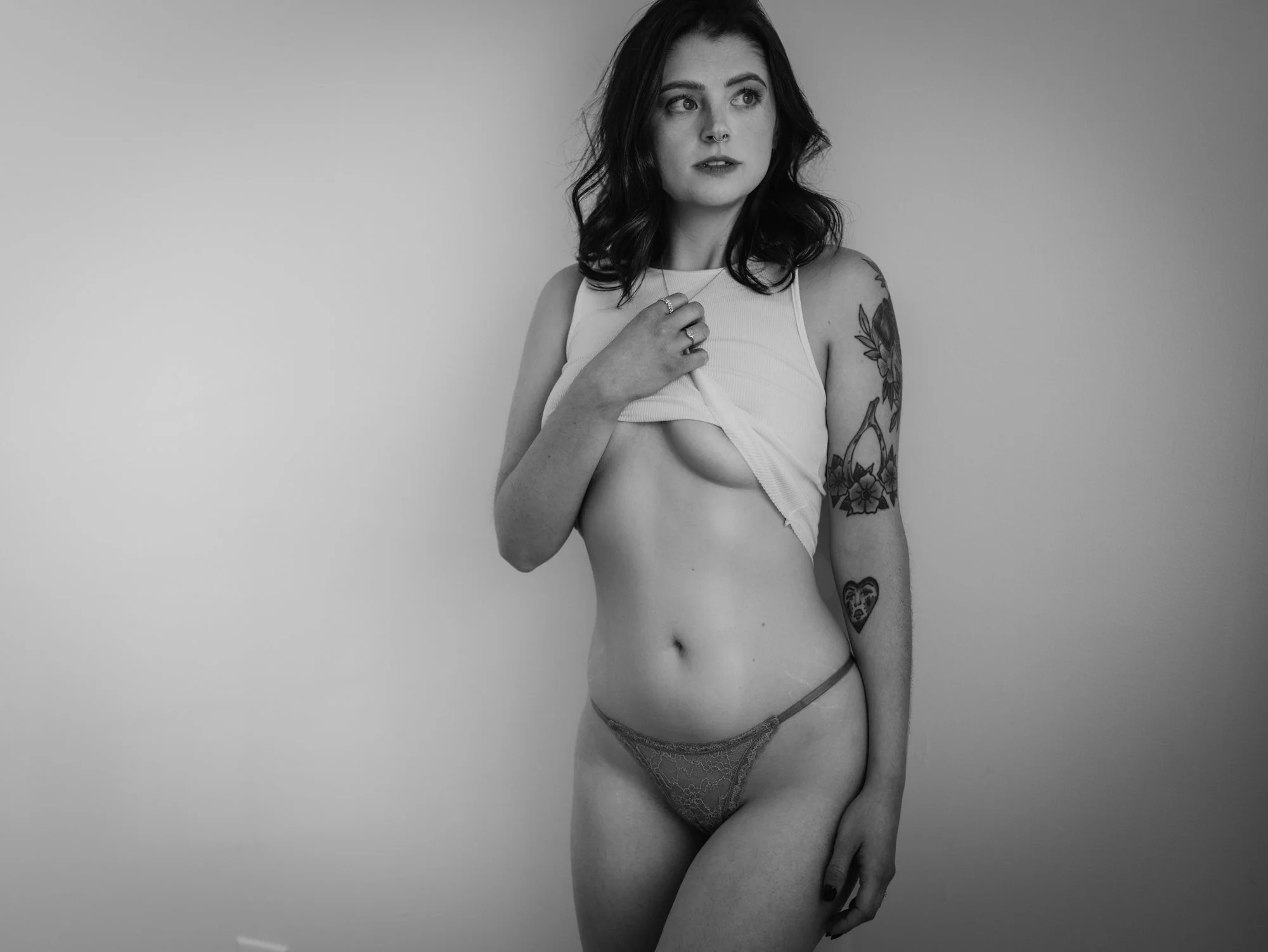 artistic boudoir photo with arched back and soft expression