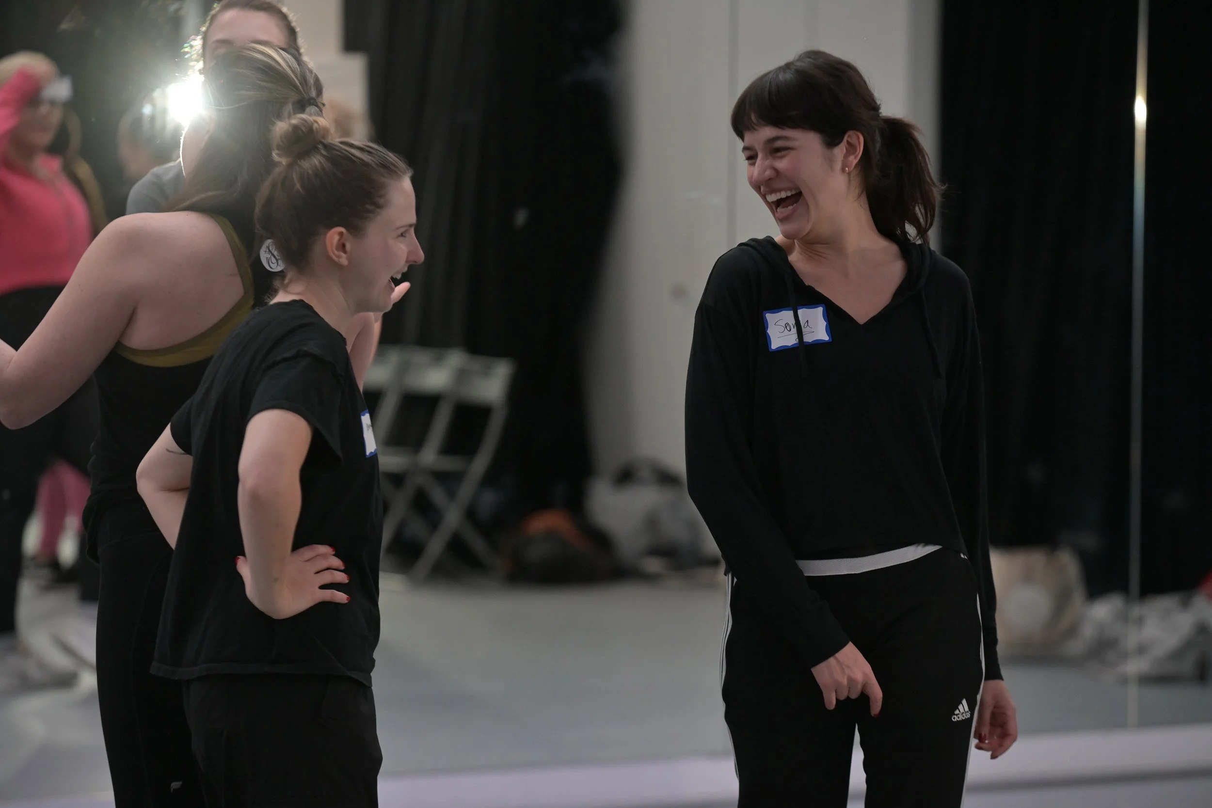 Participants sharing a joyful moment during a movement workshop