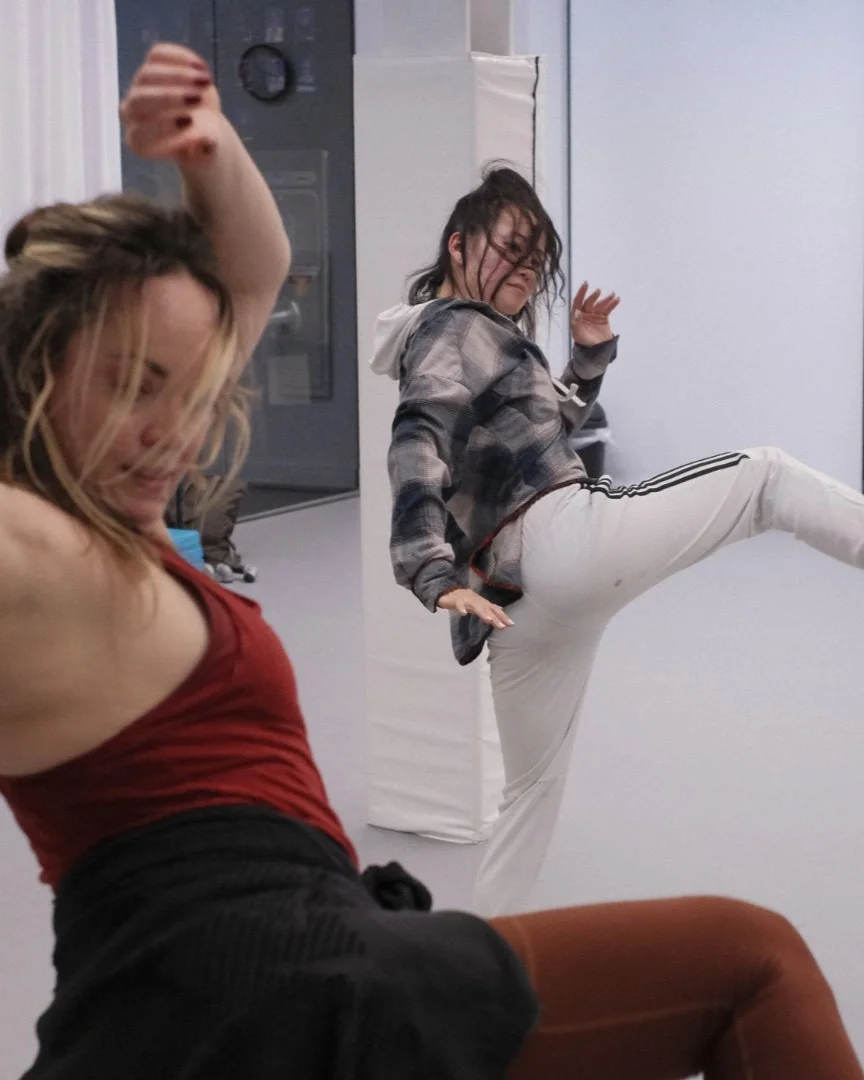 Two dancers exploring expressive movement