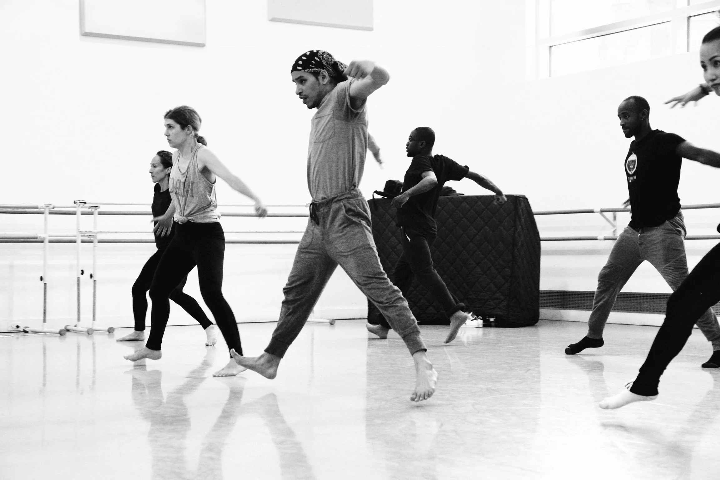 Performers exploring movement together during an ASTC rehearsal
