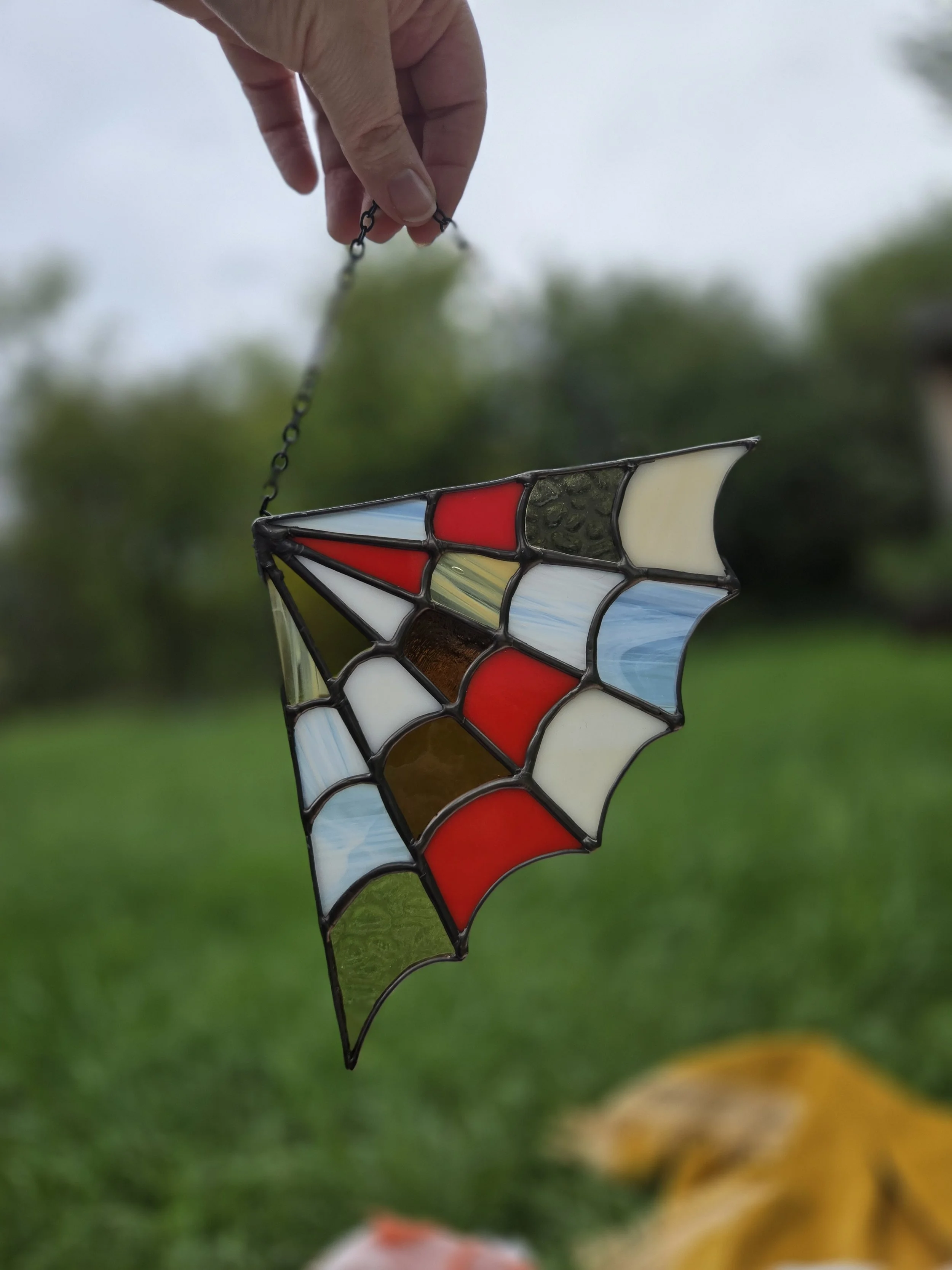 spiderweb corner stained glass- orange