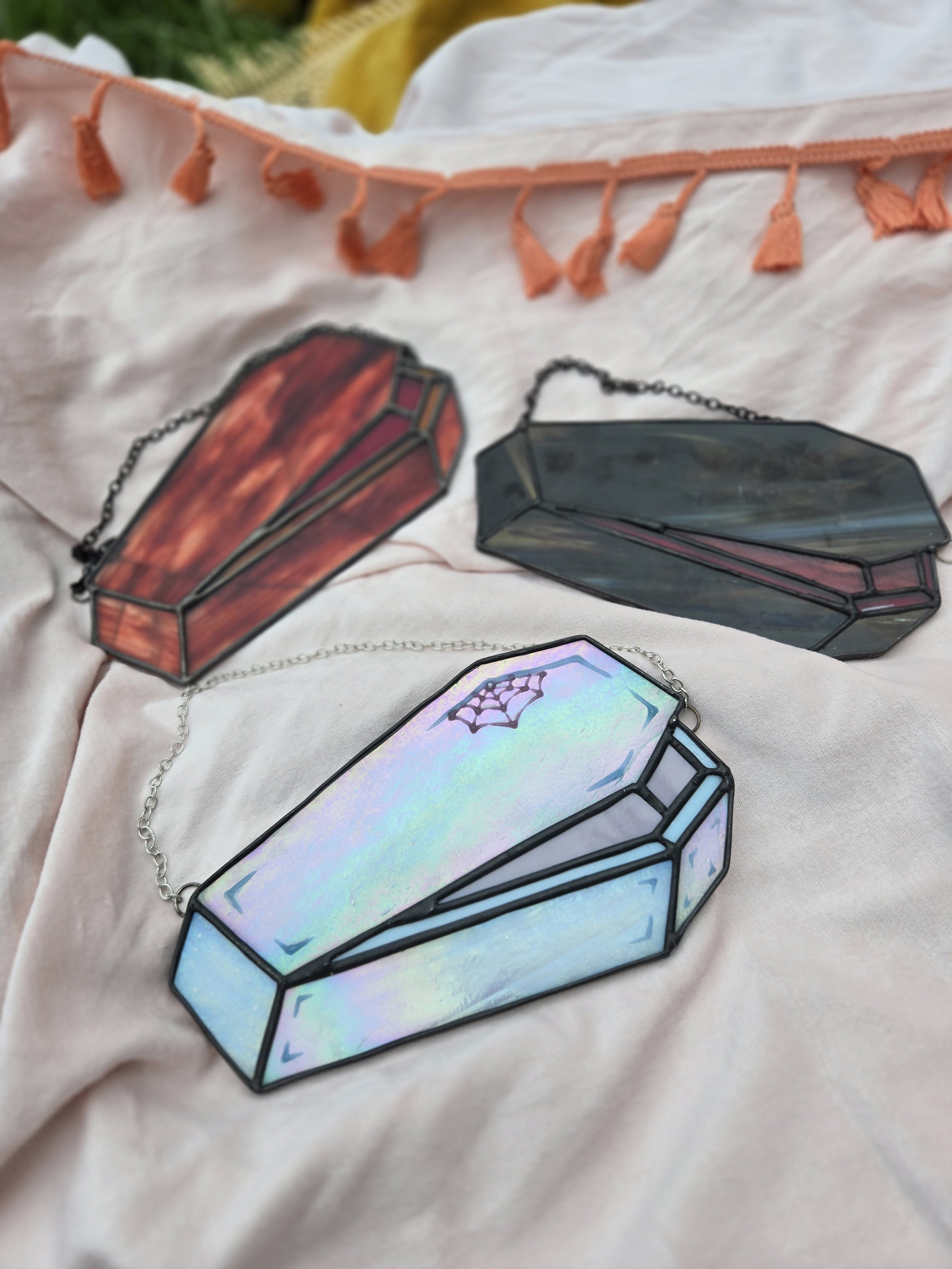 "open up" coffin stained glass suncatcher, iridescent white