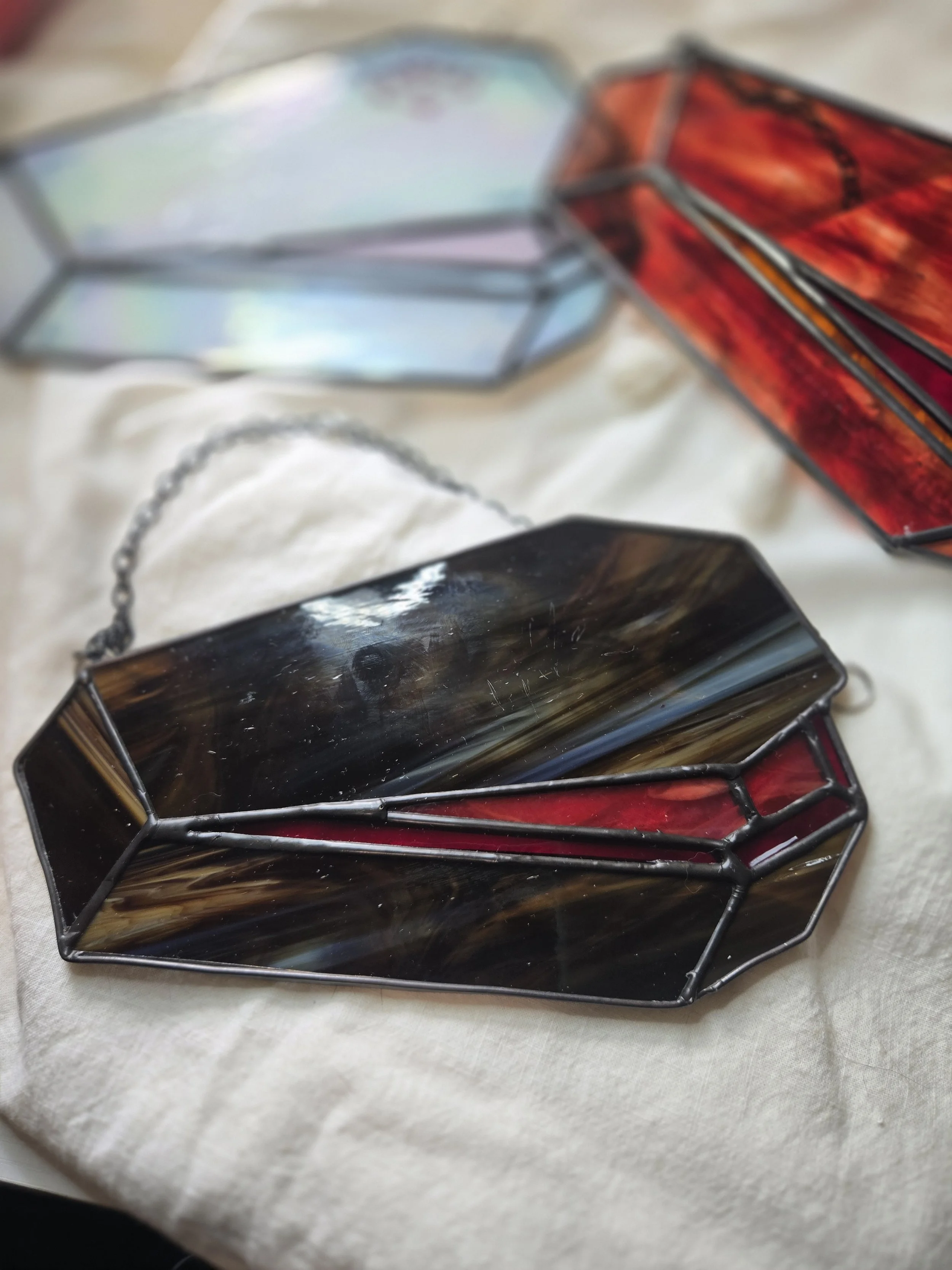 "open up" coffin stained glass suncatcher, dark brown