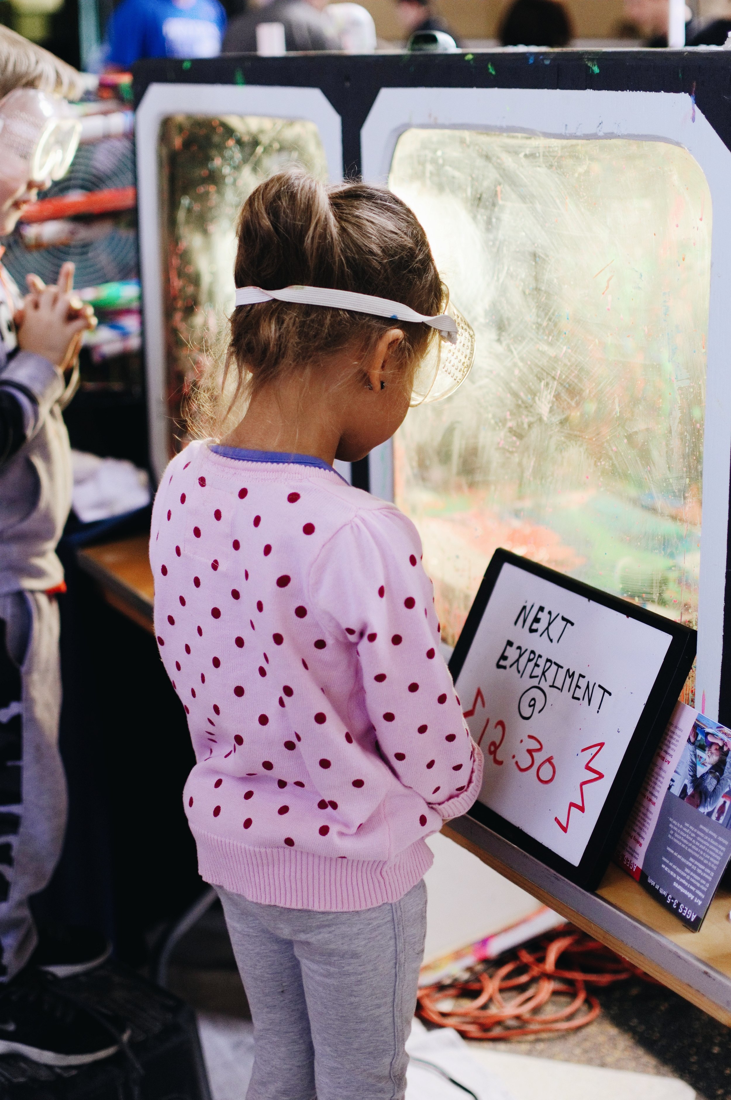 A young girl watches her experiment at the Nebraska Science Festival at the Durham Museum in Omaha, Nebraska, in 2017.
