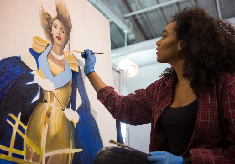Jamaica Wilson works on her painting of Beyoncé for her "Queen of Hearts" series at Richards Hall on Oct. 9, 2017, in Lincoln, Nebraska. Her series will highlight various influential women of the world.