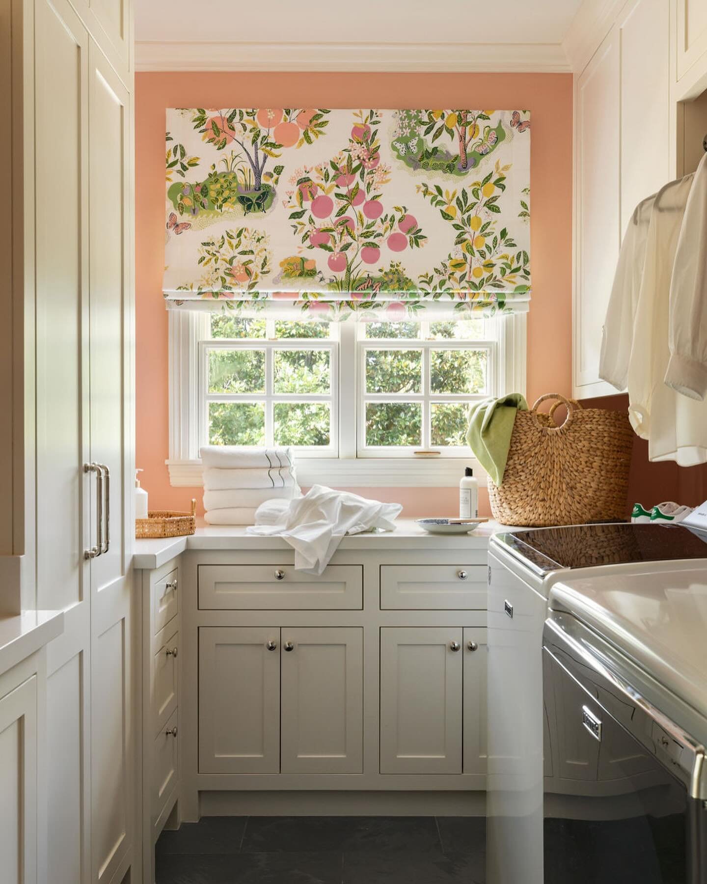 I wanted my laundry room to feel especially beautiful and cheerful. As the unsung workhorse of the home, the laundry room should spark joy and inspire tidiness... not dread. I selected a charming @Schumacher1889 Citrus Garden fabric for the window tr