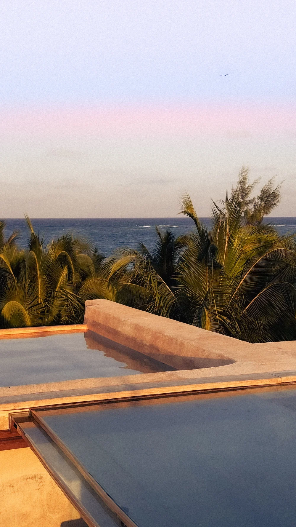 Rooftop plunge terrace with sea-to-lagoon views