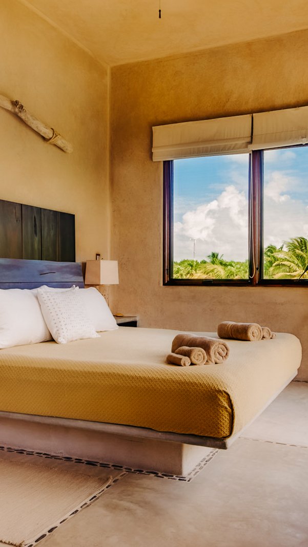 Ocean-facing suite at Casa Retreats luxury yoga and wellness retreat in Tulum, Mexico.