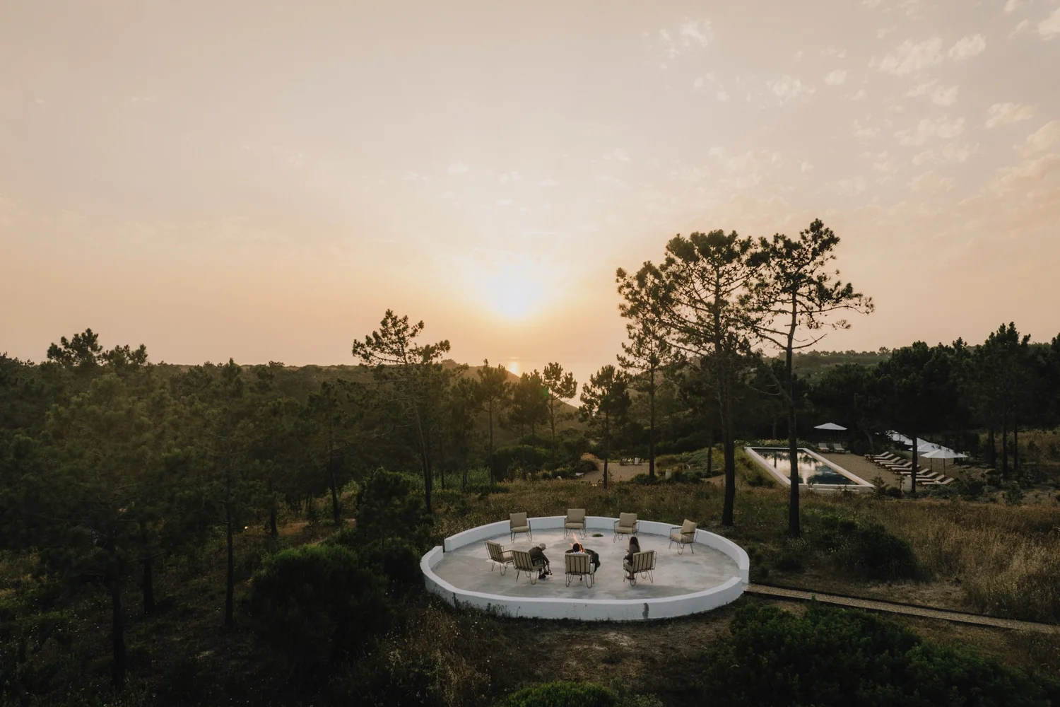 Sunset over the Atlantic from Amaria&rsquo;s circular fire terrace among the pines, Costa Vicentina, Portugal
