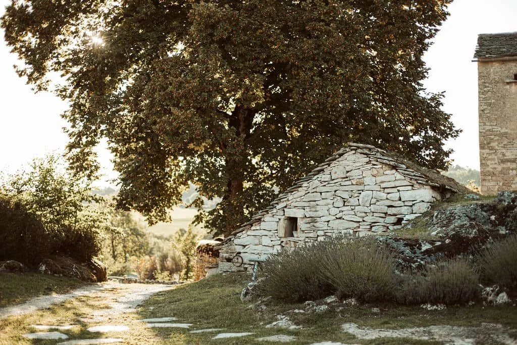 Historic stone farmhouse at L'Esprit d'Almières in the Aveyron, morning at Casa Retreats' luxury yoga retreat in southern France