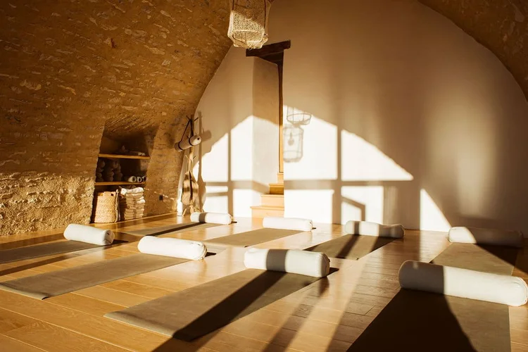Indoor stone yoga shala at L'Esprit d'Almières in Aveyron, France