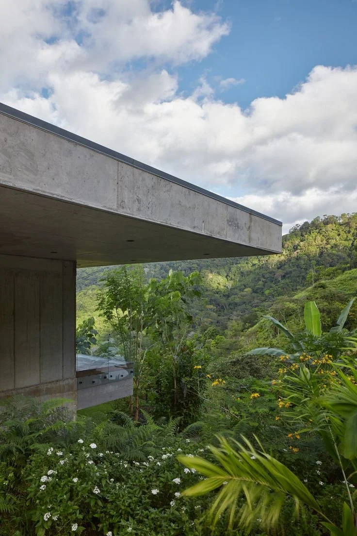 Infinity pool with sweeping jungle and Pacific views.