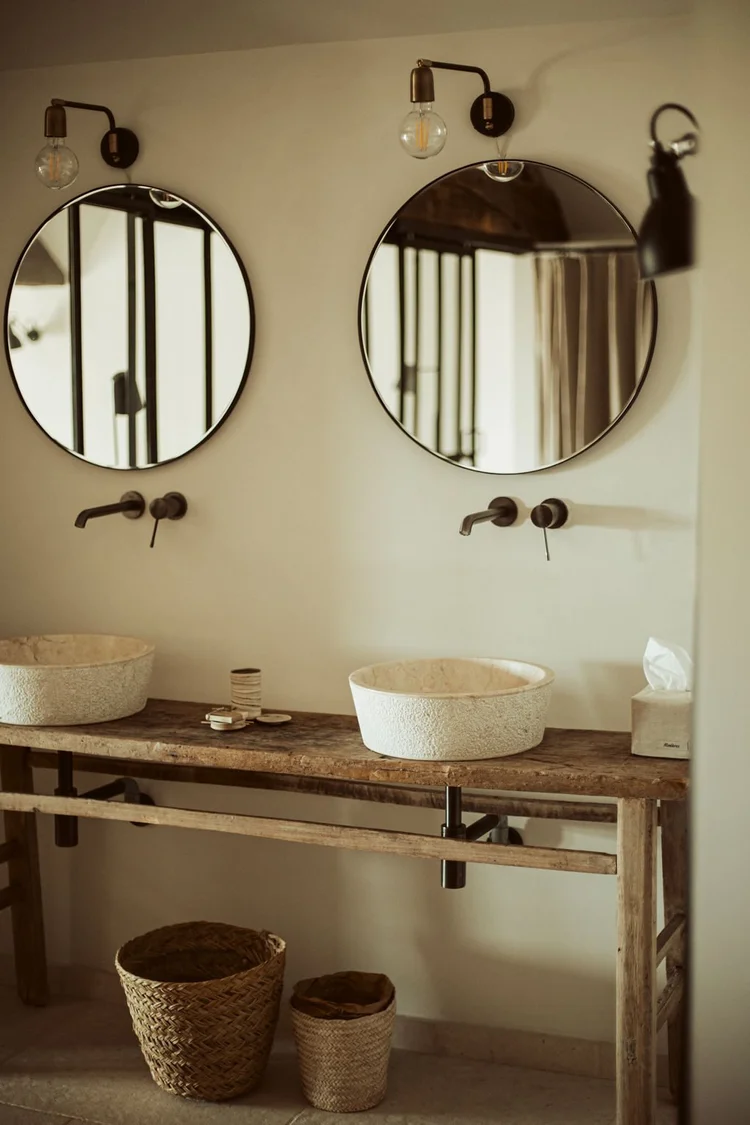 Stone double vanity bathroom in The Lodge at L'Esprit d'Almières