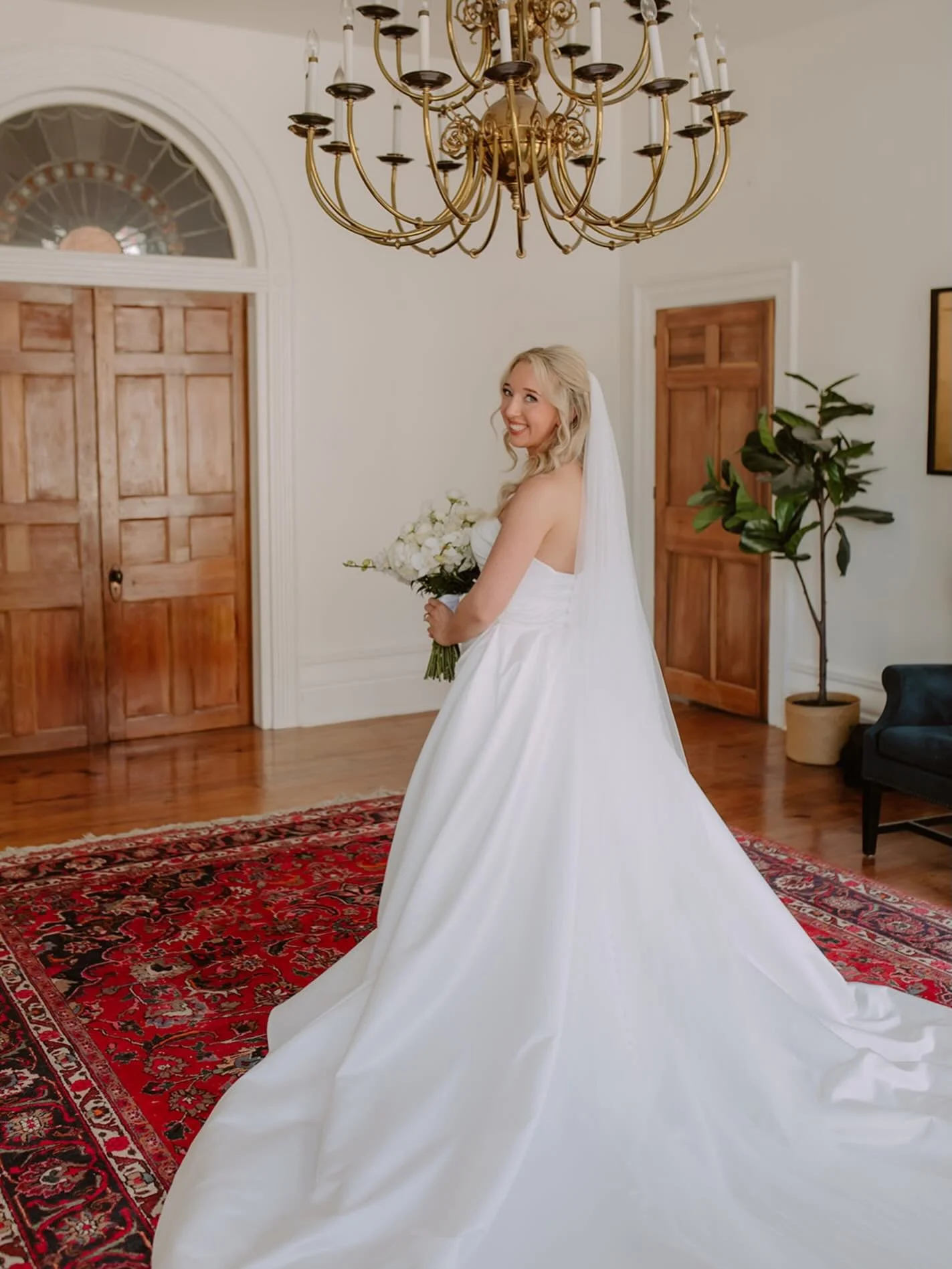 A special moment for Megan&rsquo;s stunning gown in celebration of National Say Yes to the Dress Day. At Harper Hall, we offer a first-floor suite that many of our couples and clients use as a dressing room. We also provide an add-on option of a spac