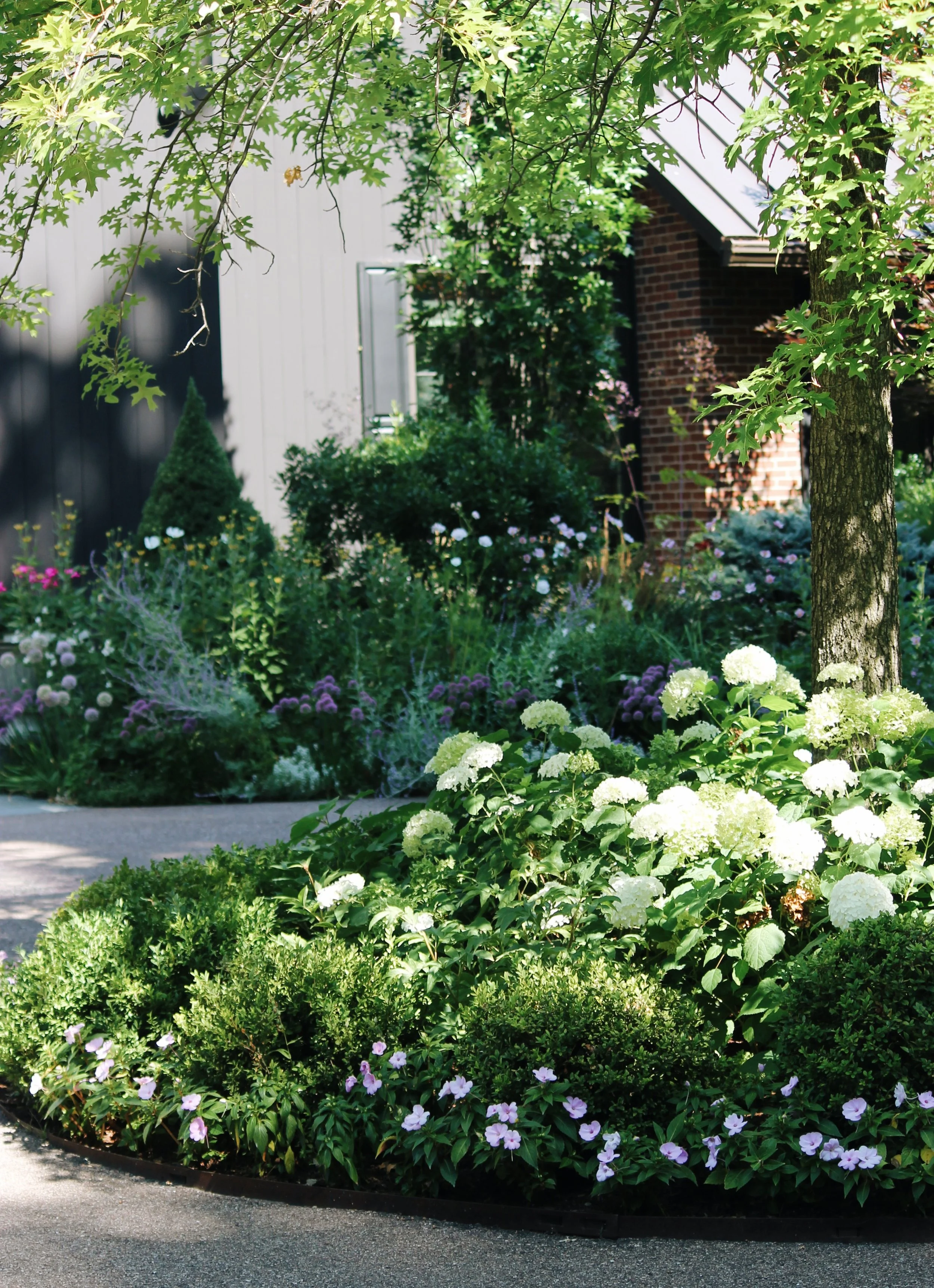 Naturalistic English cottage garden planting at Lands End Lane in Shelburne Bay, Vermont