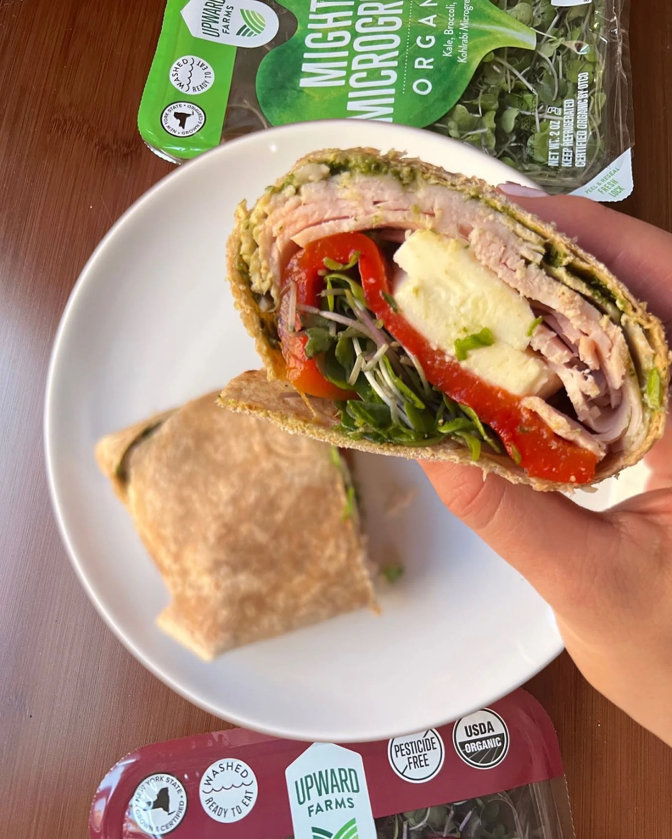 This wrap combo has become a go-to weekday lunch! Whole wheat wrap with pesto, turkey, fresh mozz, roasted red peppers, and @upwardfarms microgreens for a boost of flavor nutrients! #ad