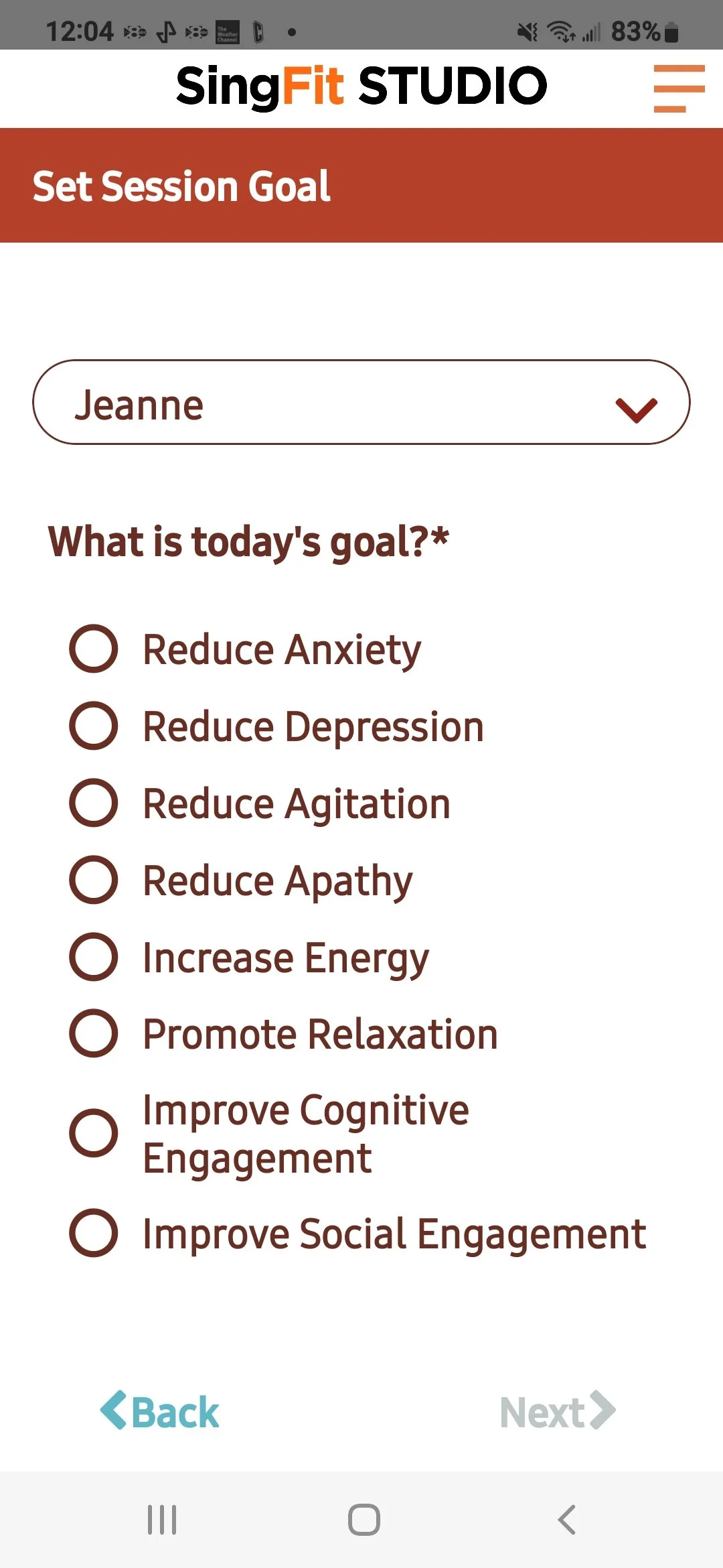 Mobile screen showing a session goal selection form from the SingFit Studio app. The user named Jeanne is selecting a goal, with options including reduce anxiety, reduce depression, reduce agitation, reduce apathy, increase energy, promote relaxation, improve cognitive engagement, and improve social engagement.