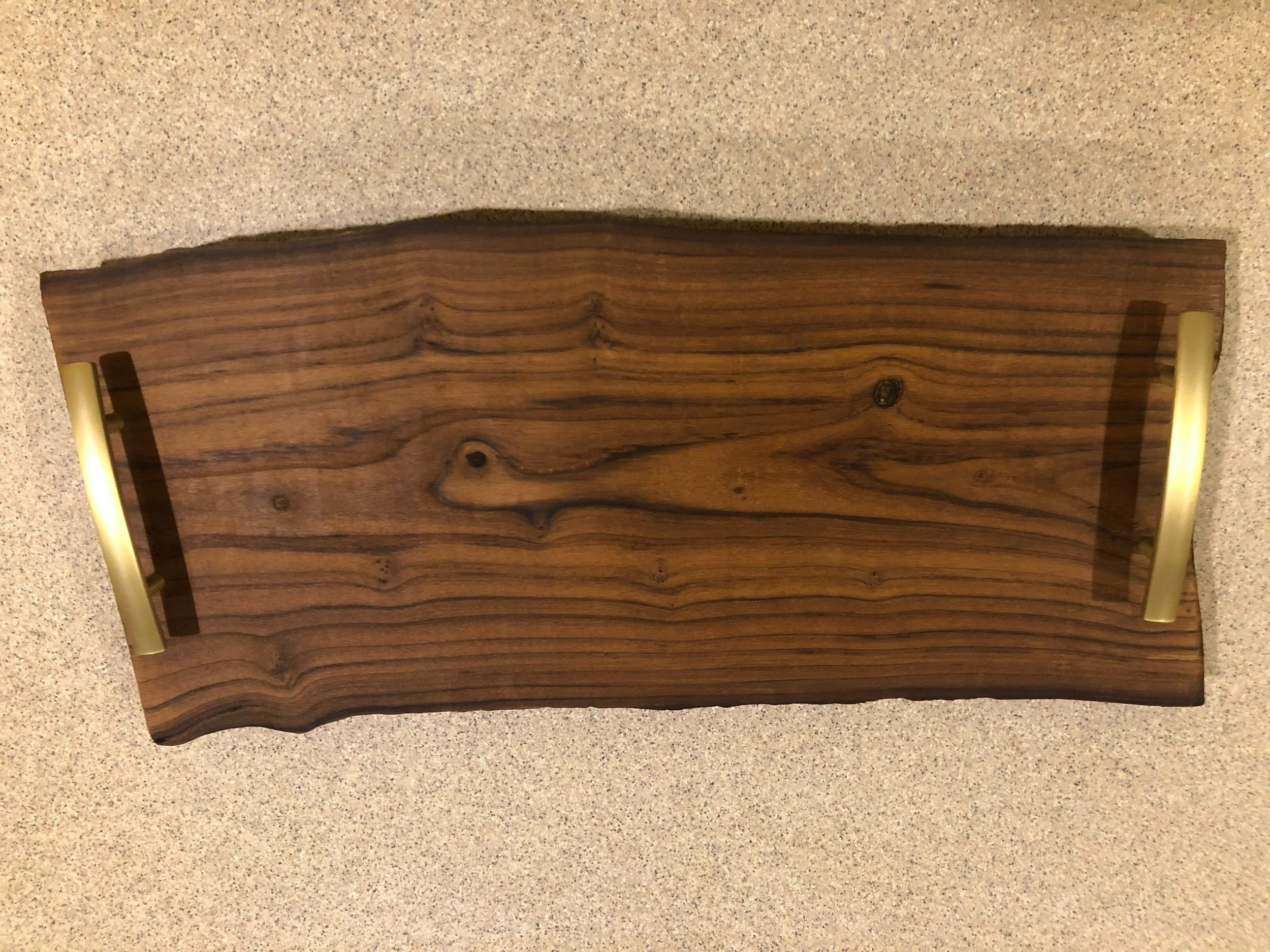 Charcuterie board with handles.