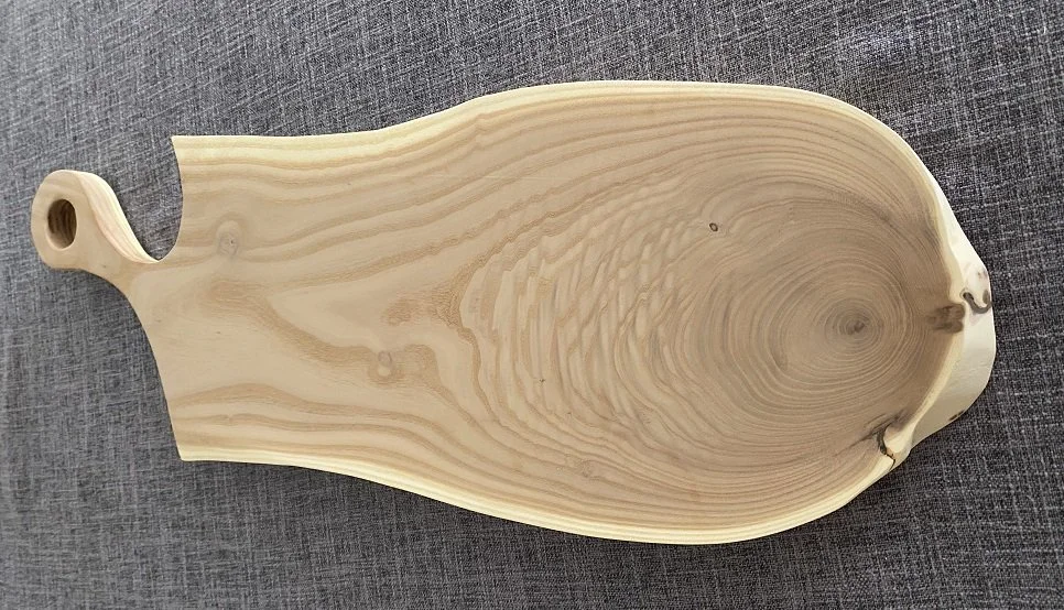 Russian olive charcuterie board with handle.