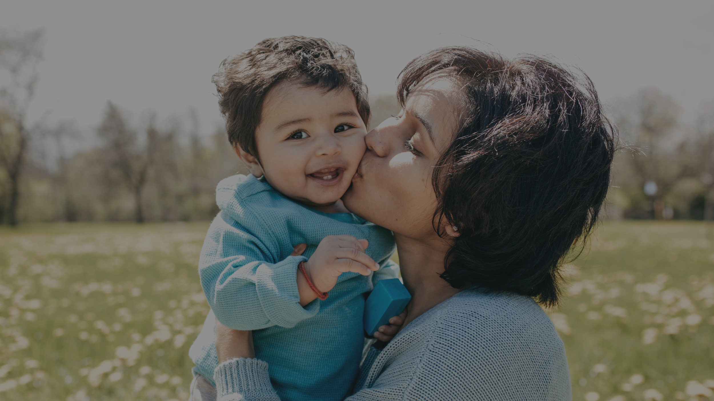 5M. Mom kissing toddler.png