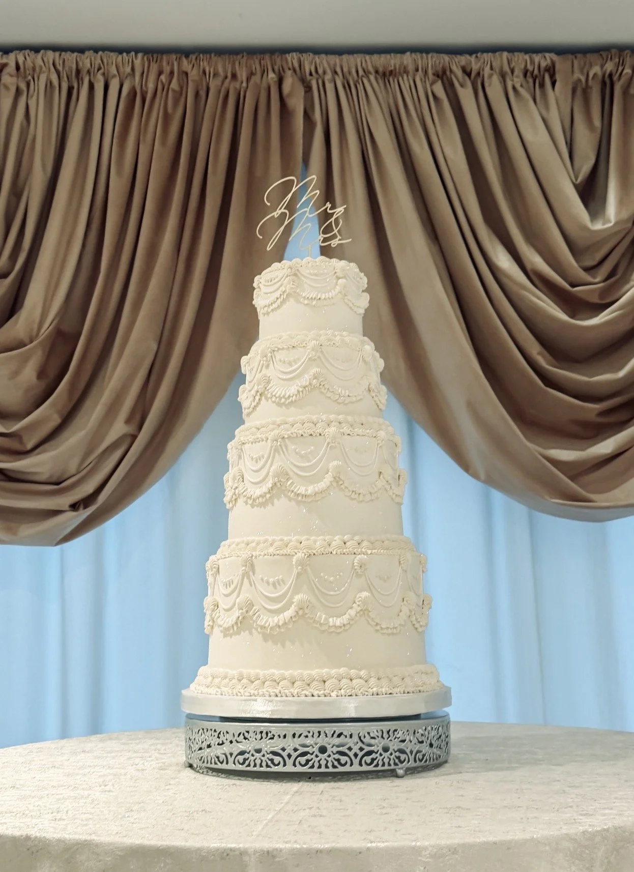 Four-tier vegan wedding cake vintage style design by veg ons board for a wedding at The Mill River Club in Oyster Bay, NY