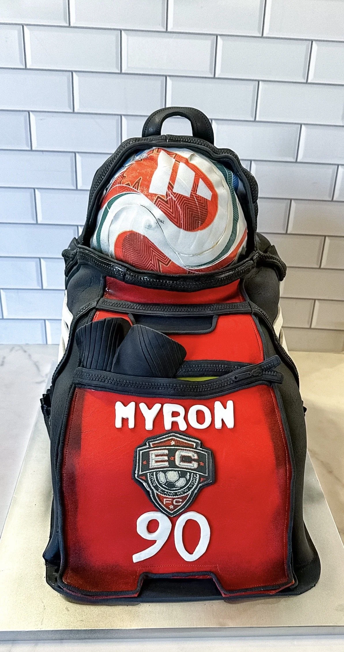 vegan custom soccer bag shaped cake 
