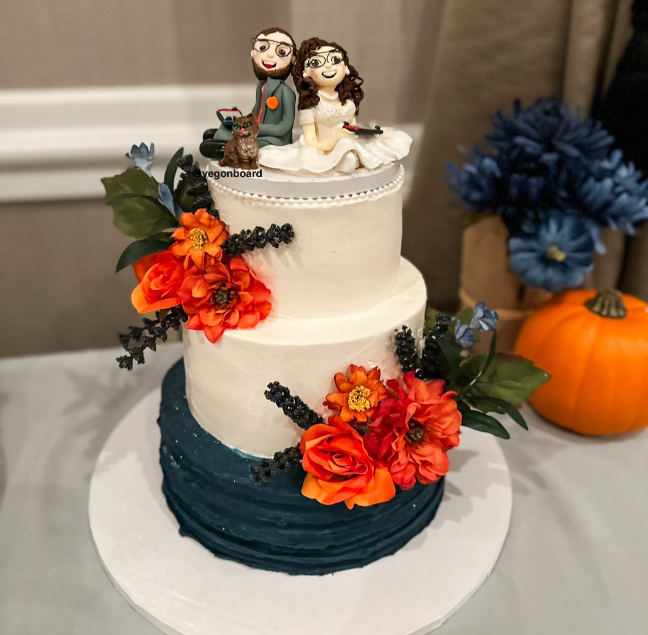 Two-tier wedding cake with custom handmade cake topper Veg on Board Long Island NY