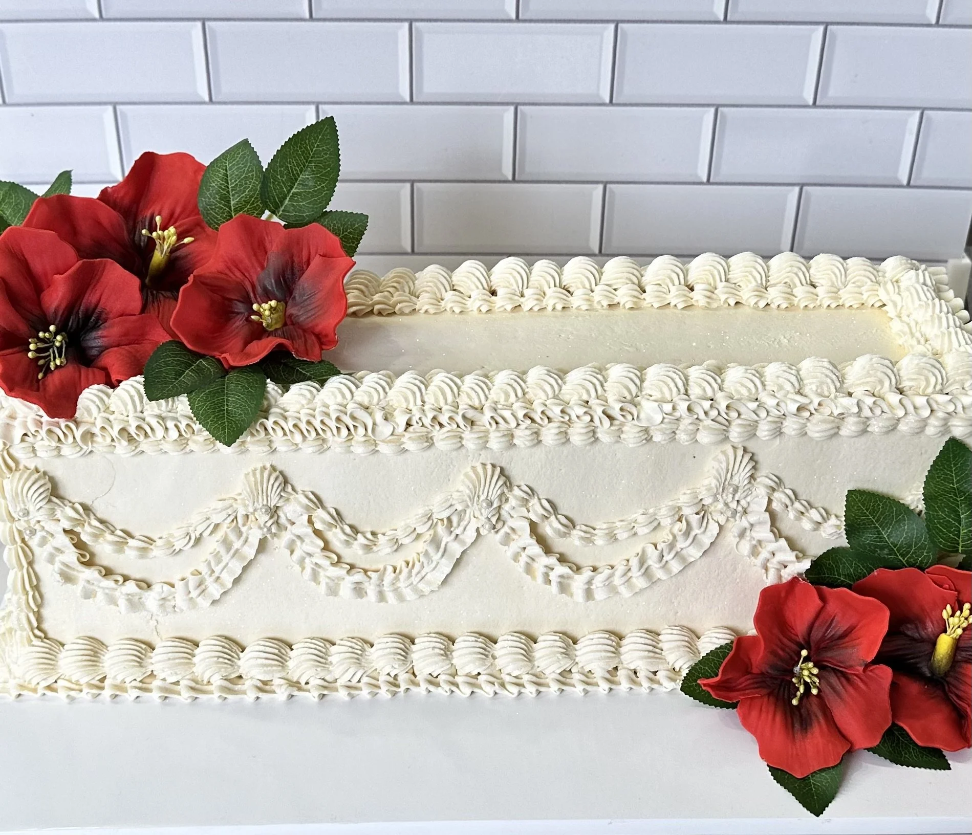 Long vintage style vegan sheet cake with hand sculpted Flor de Mega flowers and detailed piping designed by Veg on Board on Long Island