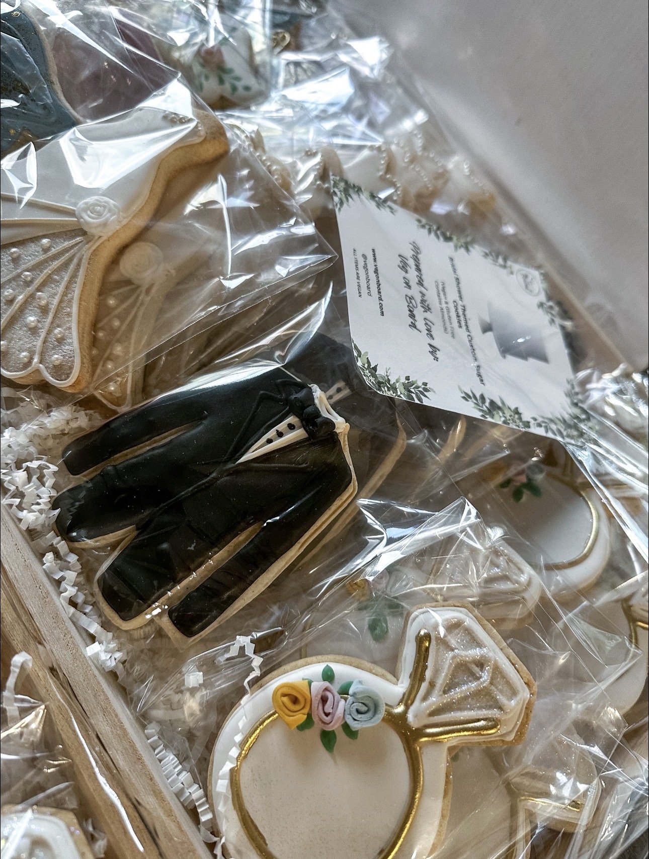 Vegan custom bridal shower cookies with groom, bride, and engagement ring cookies