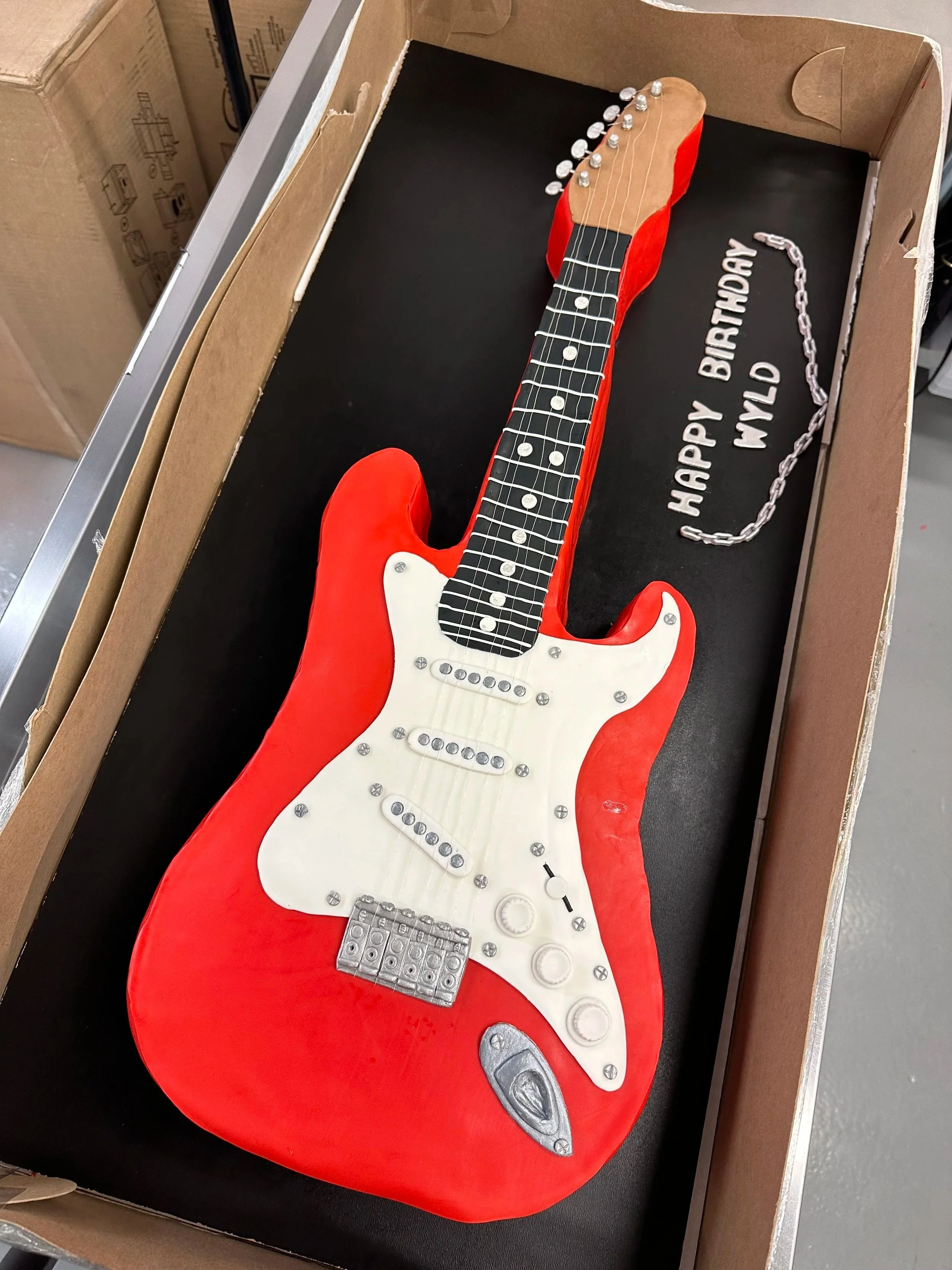 custom guitar cake designed for a music lover celebration